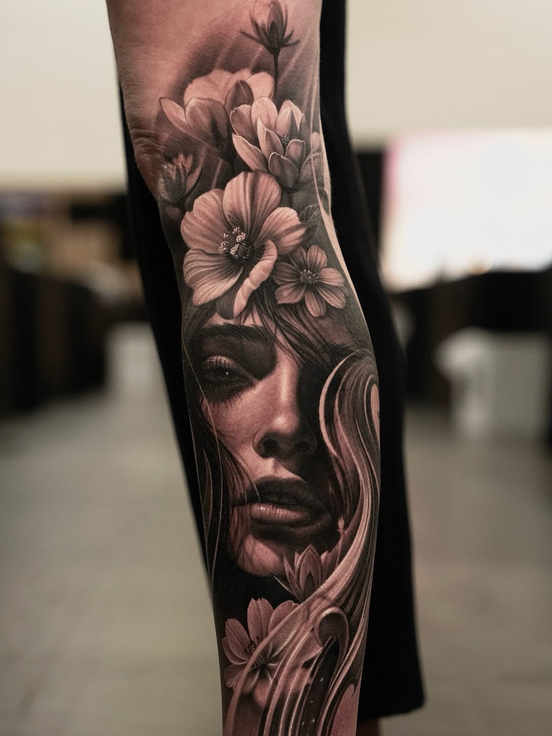 Woman and flowers realism tattoo on the forearm by @_garart_