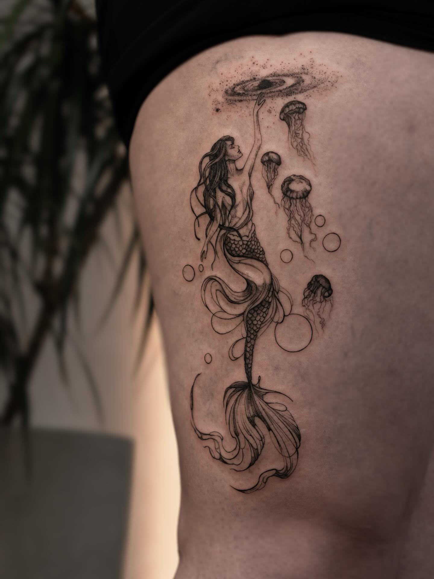 Mermaid and jellyfish realism tattoo on the thigh by ᴛᴀᴛᴛᴏᴏ ᴀʀᴛɪꜱᴛ 📍Portland, OR