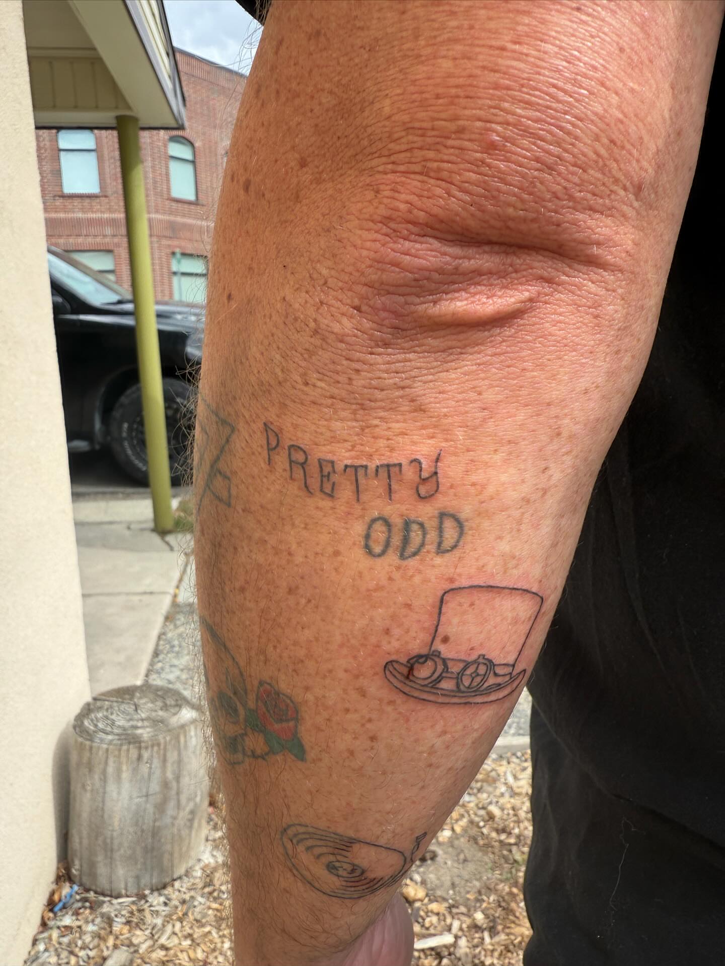 Pretty odd lettering script tattoo on the forearm by Kylee Snow