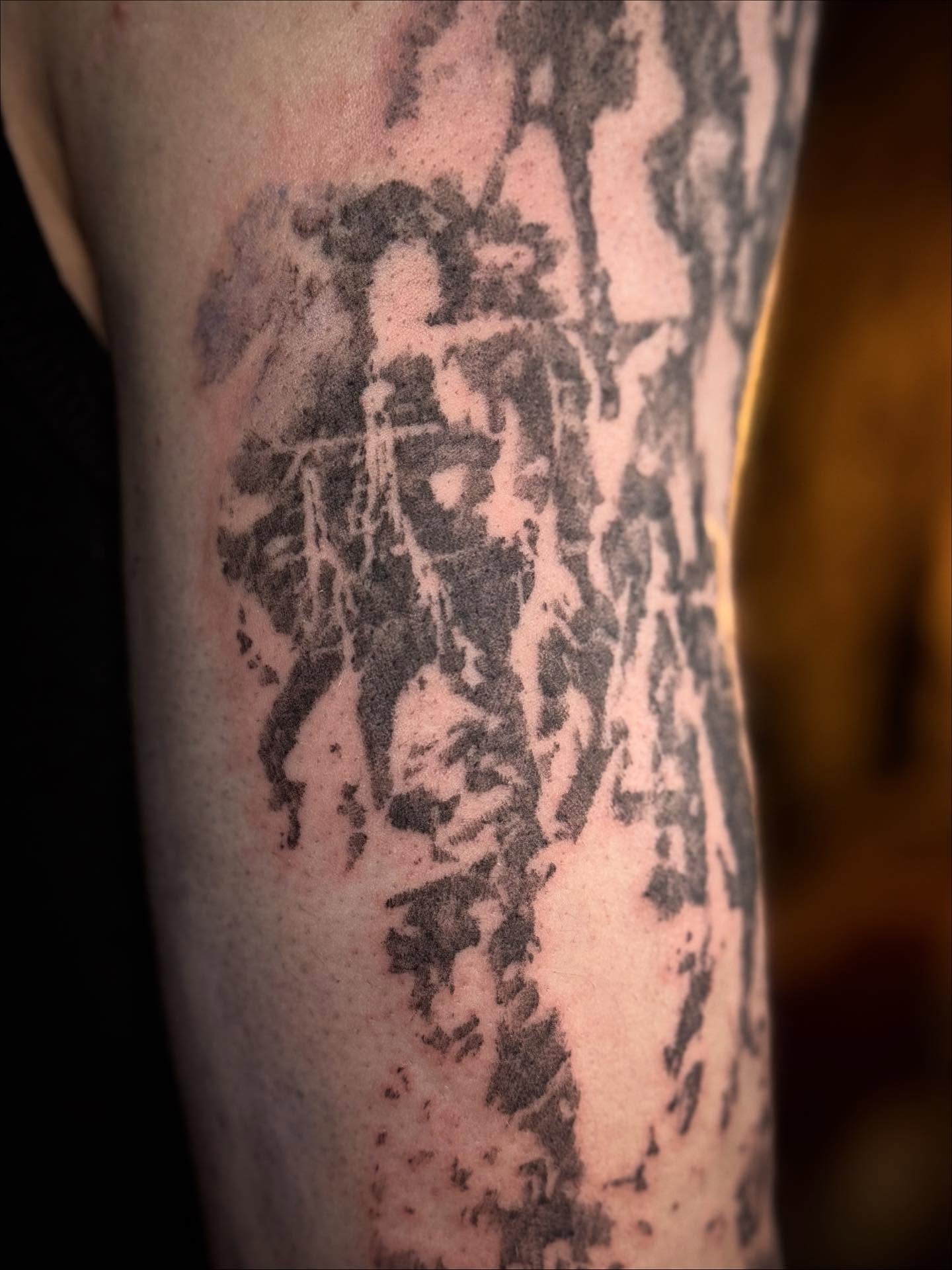 Abstract figure black and grey tattoo on the forearm by Jamie Draven 🐺