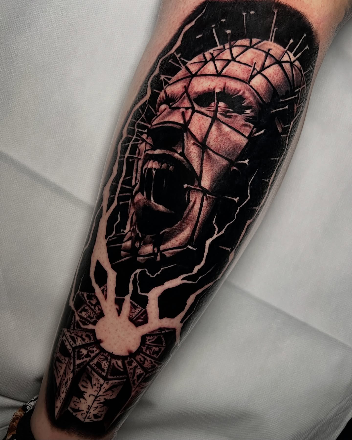 Pinhead dark realism tattoo on the forearm by James Foltz