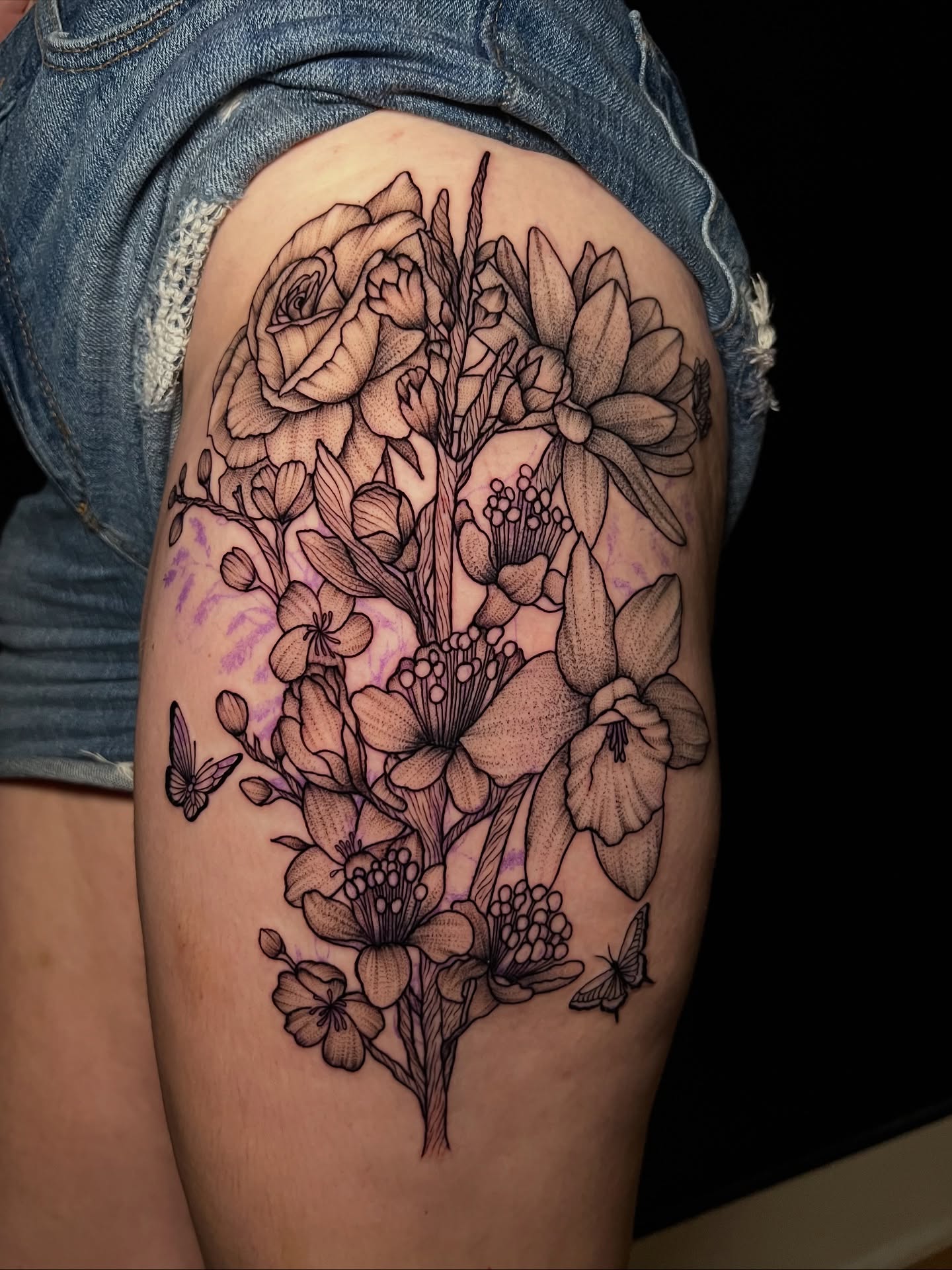 Floral bouquet dotwork tattoo on the thigh by Baung Ben