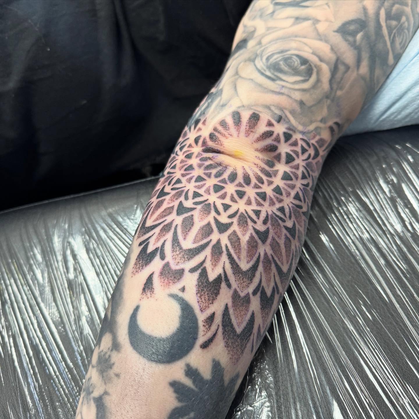 Mandala geometric tattoo on the forearm by Robbie Bryant