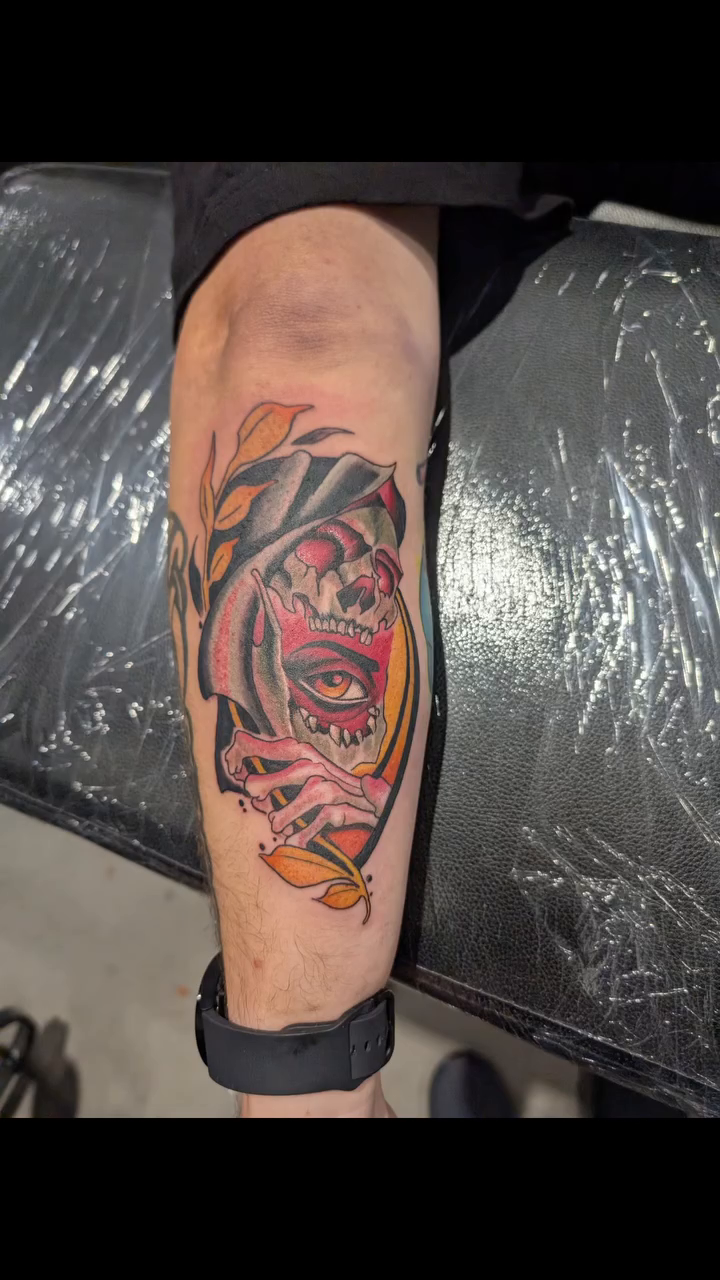 Tiger head with floral elements dark art tattoo on the forearm by Ben Cecil, Summerville, South Carolina