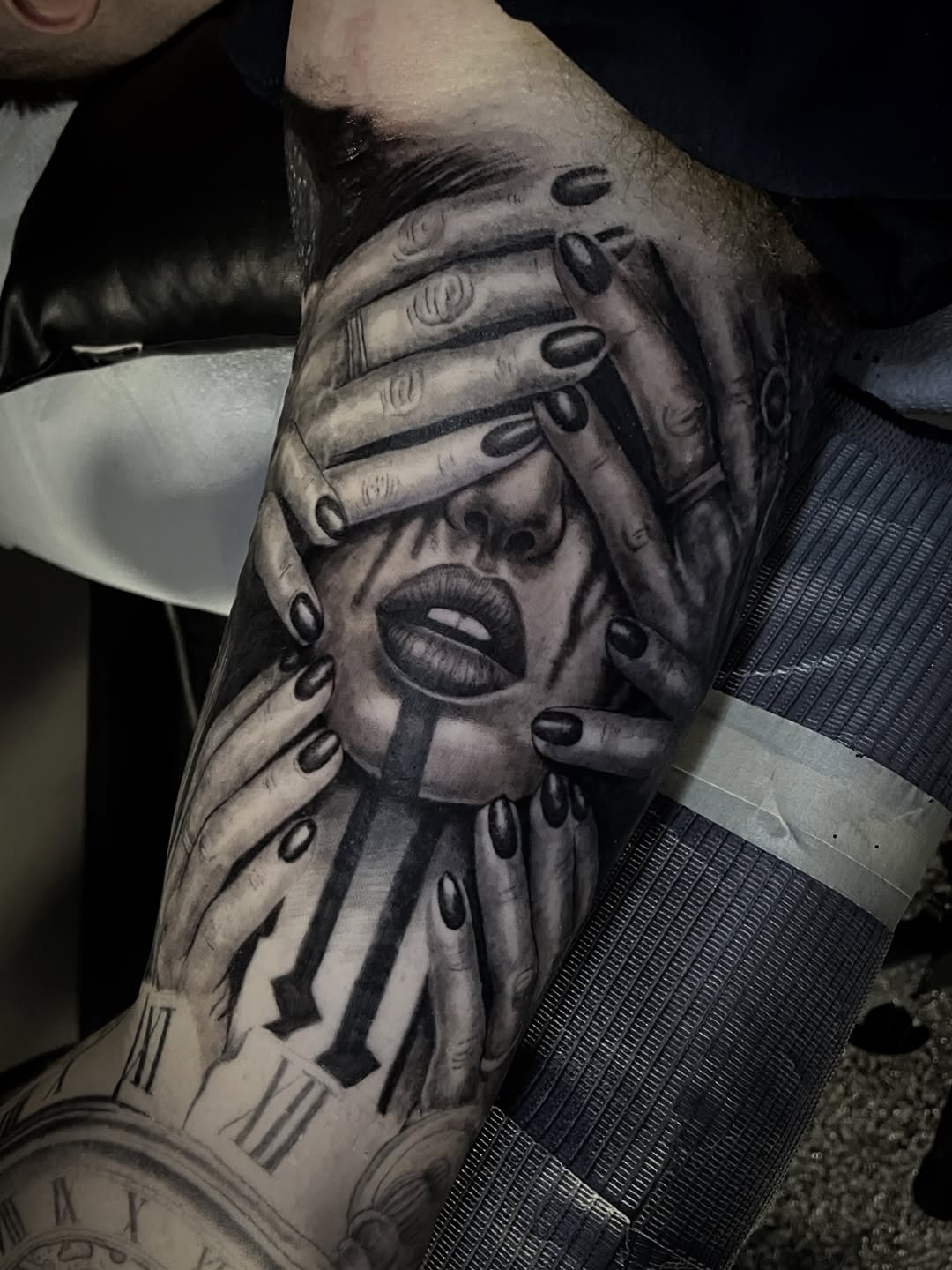 Face covered by hands realism tattoo on the forearm by Charlie