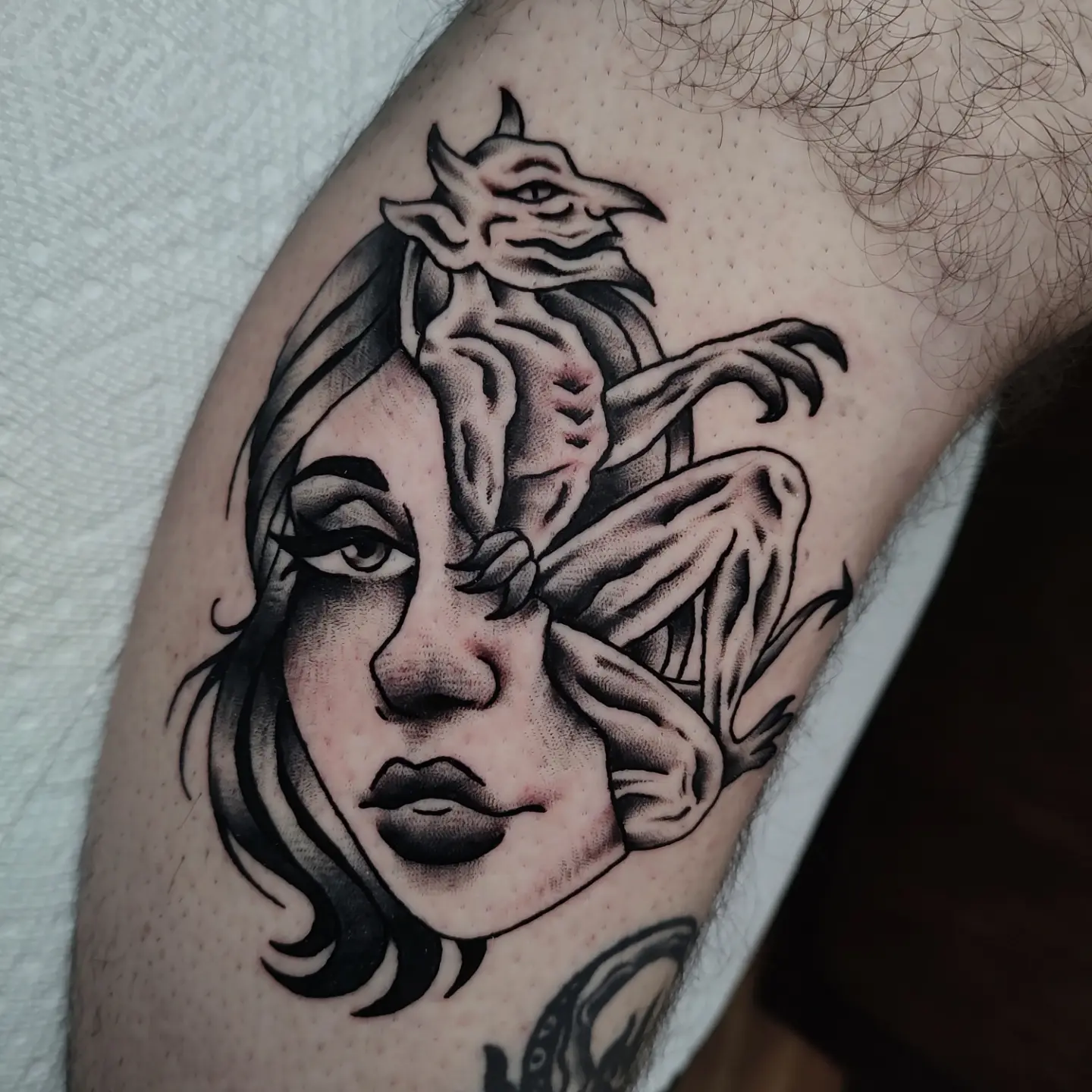 Woman with dragon realism tattoo on the forearm by Hope Higgins