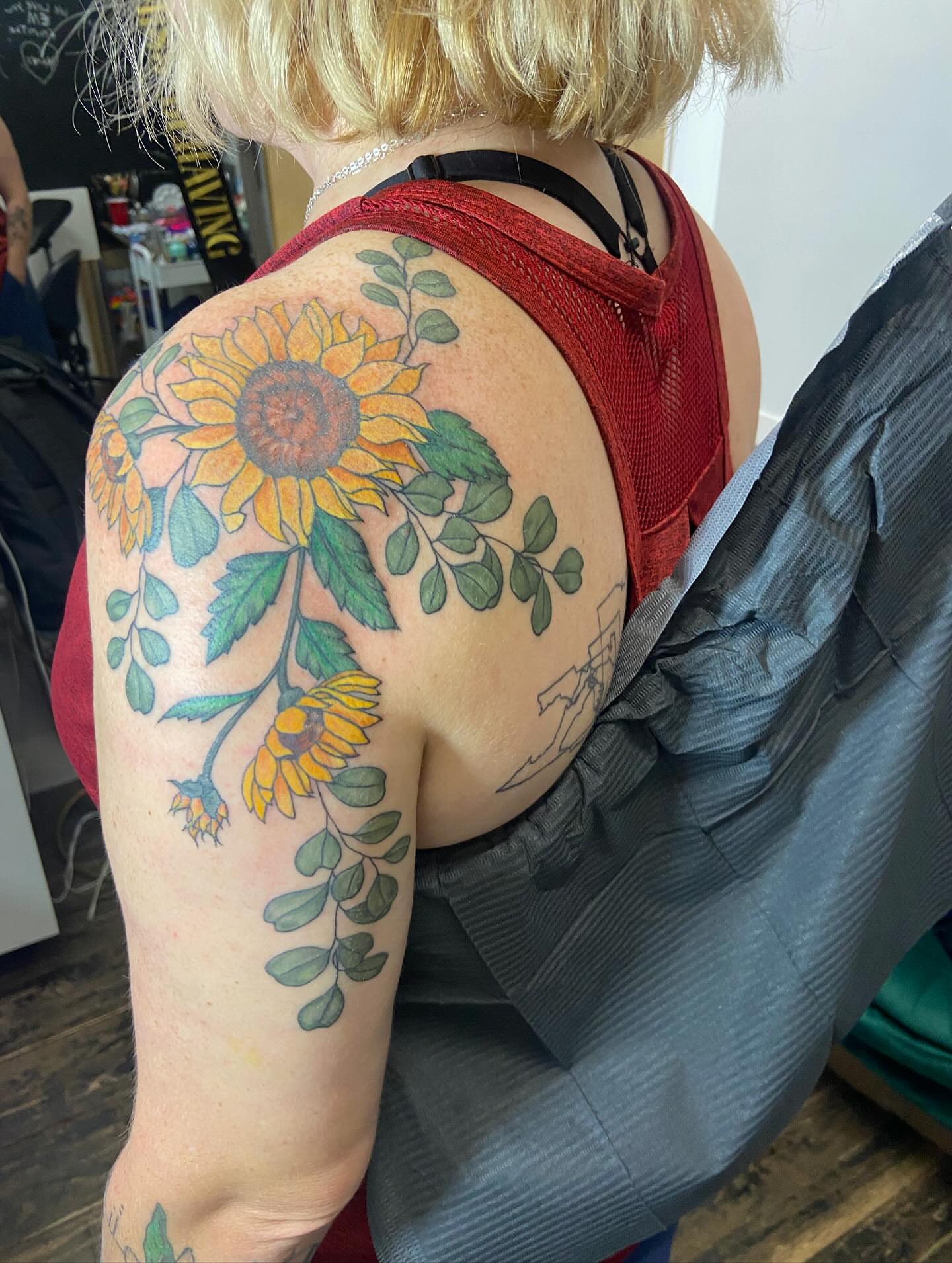 Sunflower bouquet realism tattoo on the shoulder by Dont Worry About It