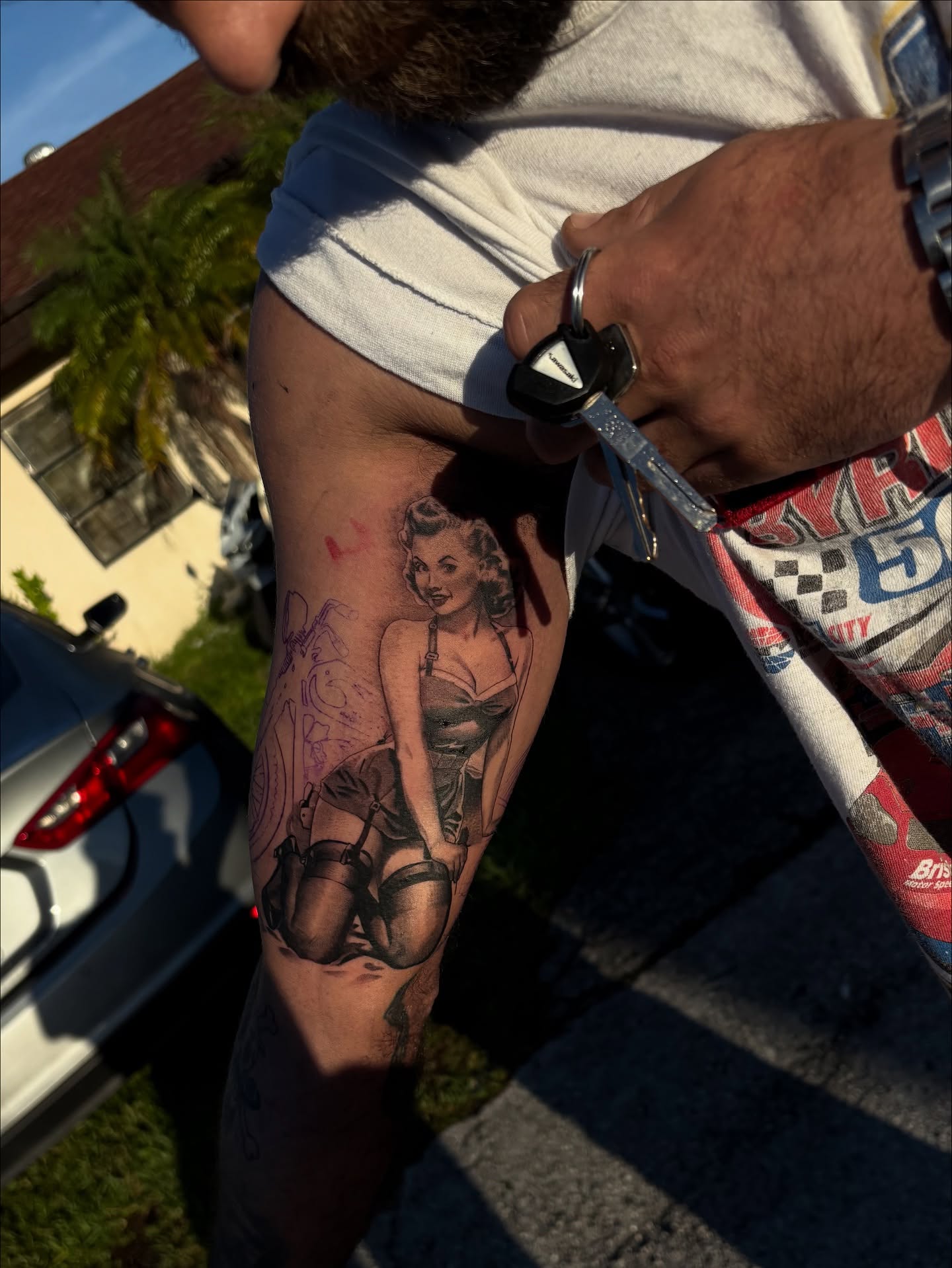 Pin-up girl American traditional tattoo on the forearm by Lemaih Gonzalez