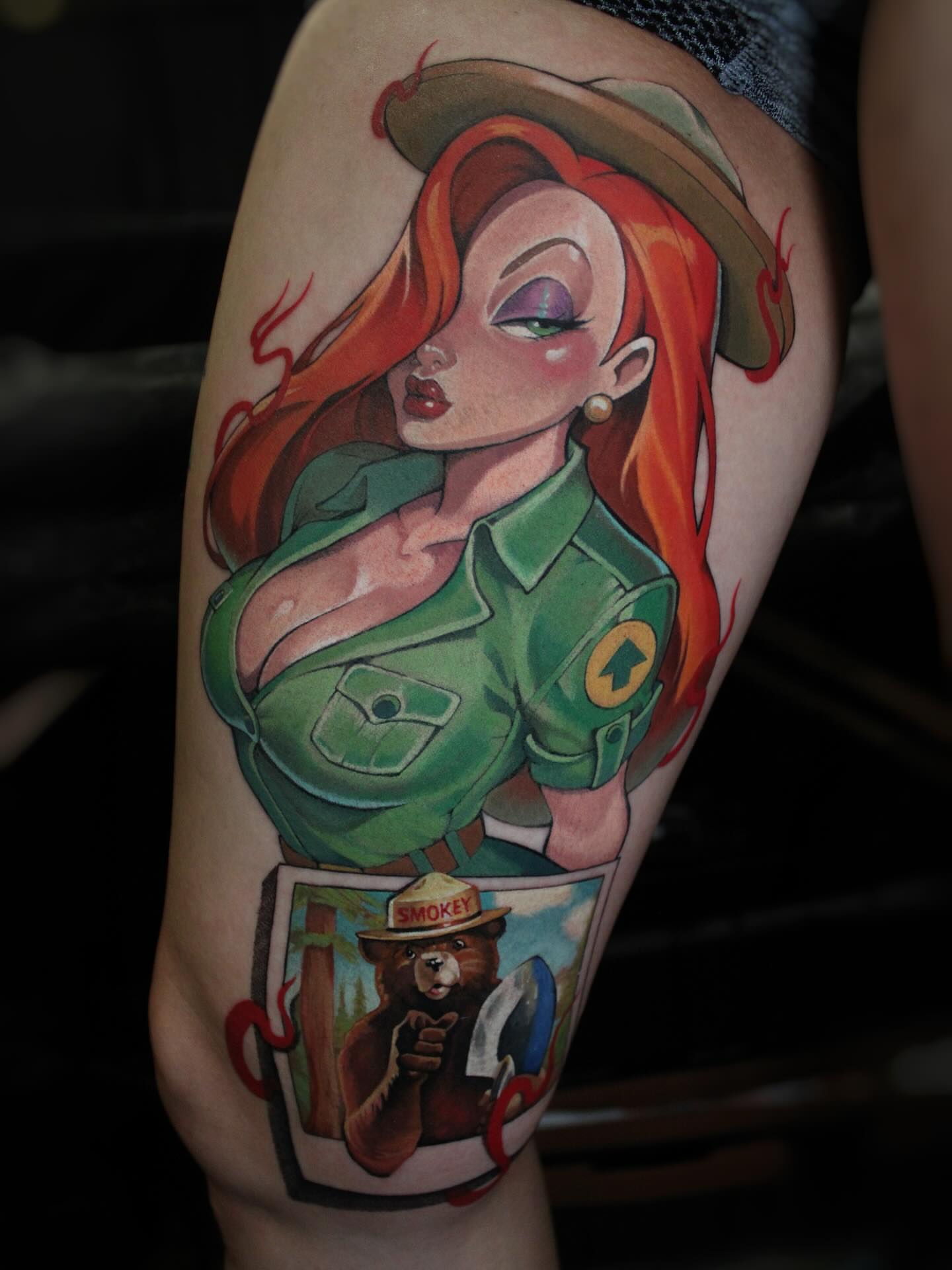 Female firefighter with Smokey Bear illustrative tattoo on the thigh by πΆππ πΎππππππ