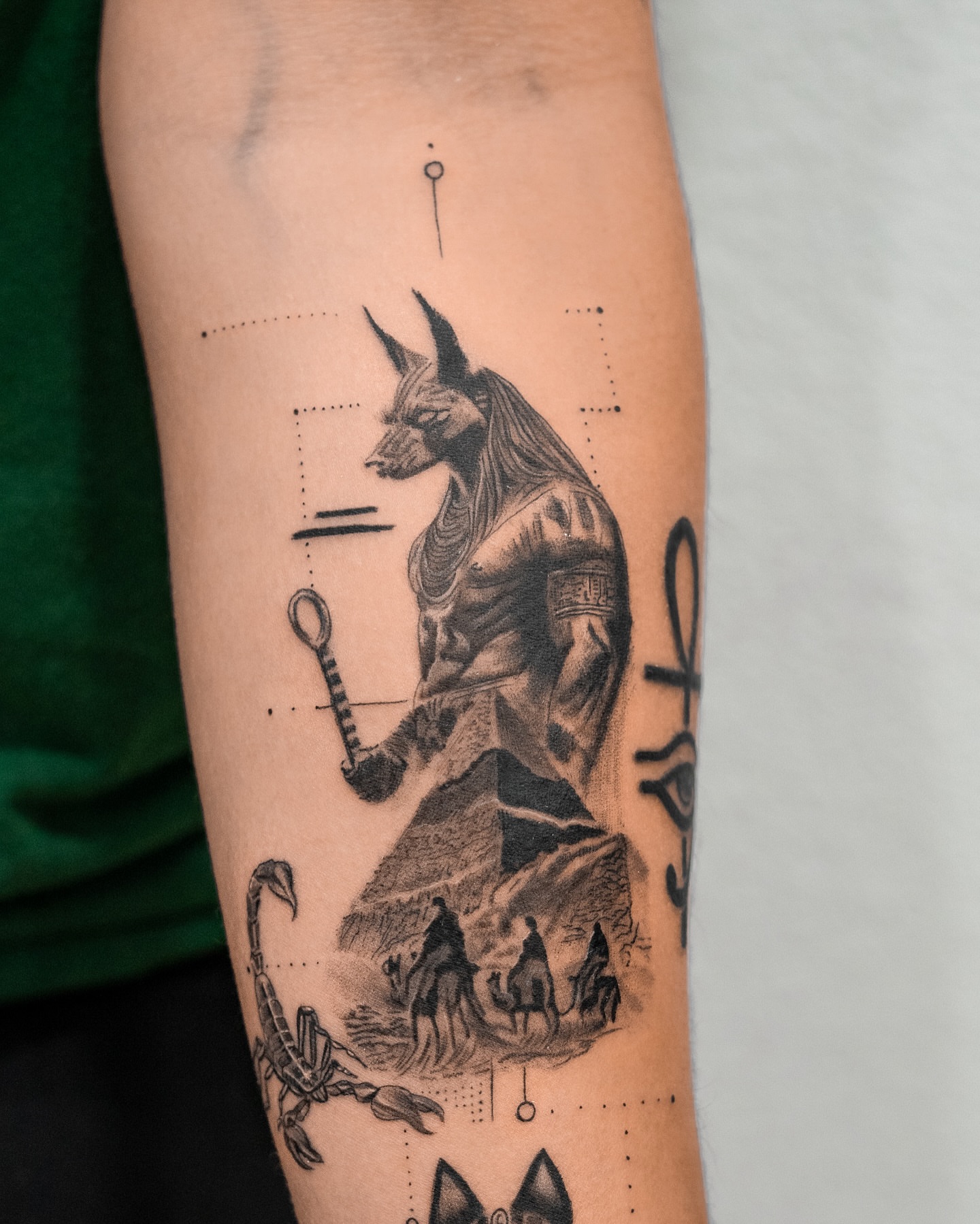 Ancient god with scorpion geometric tattoo on the forearm by The Tattoo Plug