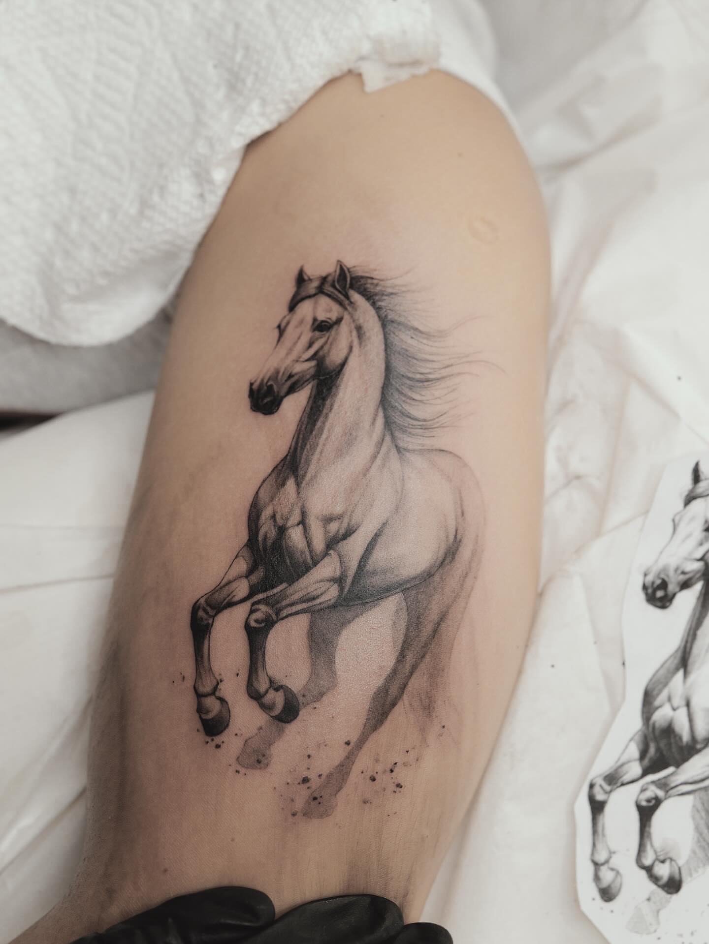 Galloping horse realism tattoo on the thigh by Tattoo Artist