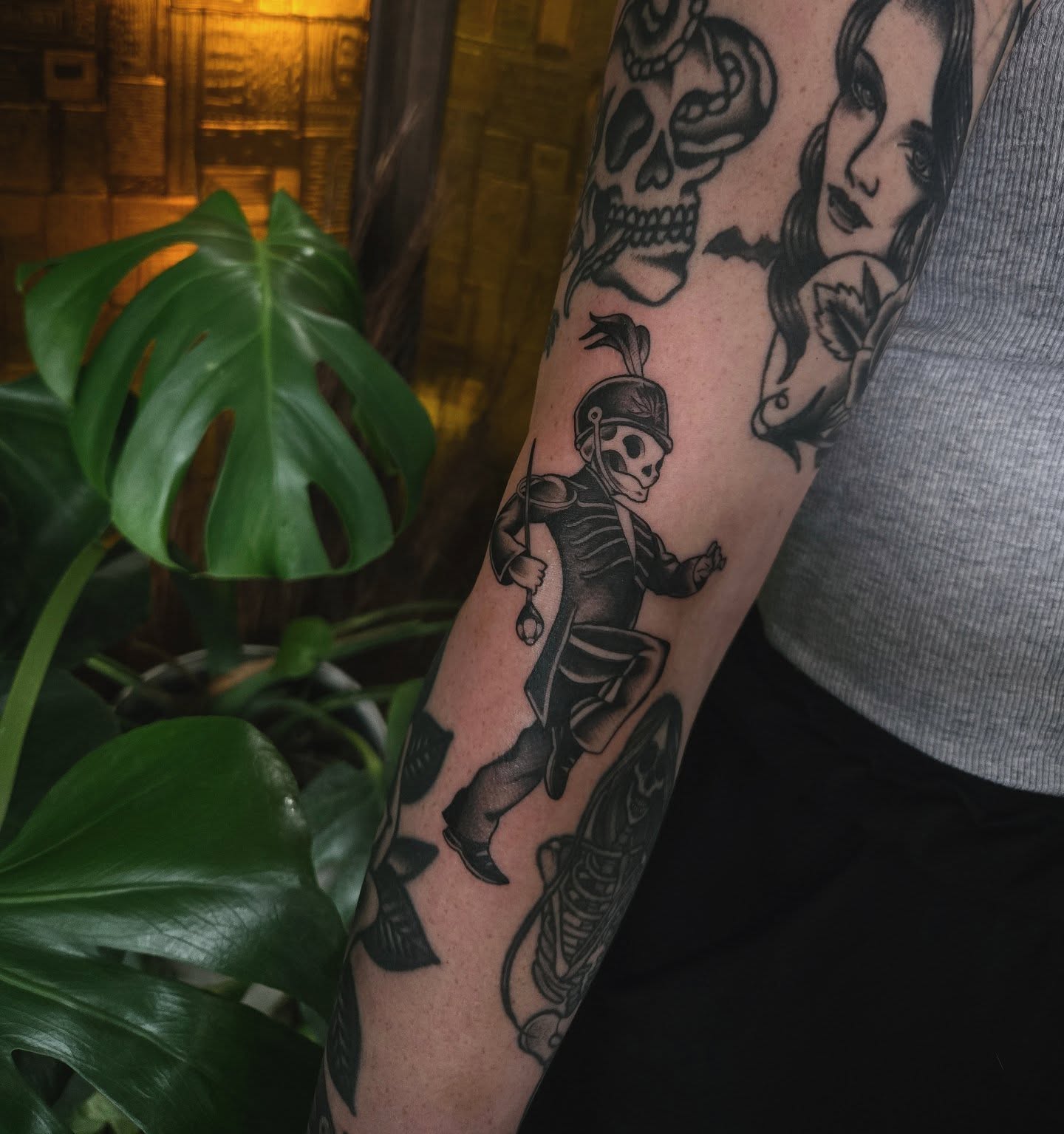 Skeleton in armor black and grey tattoo on the forearm by Alexandra Colella ✨️