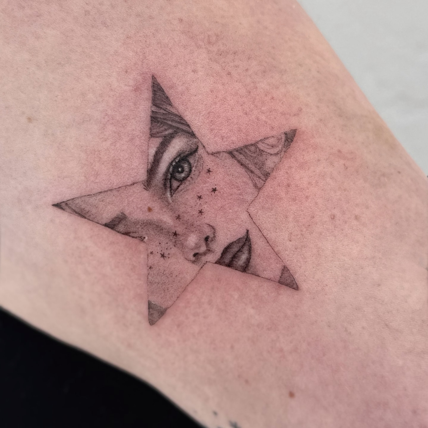 Eye and star realism tattoo on the forearm by Raleigh tattoo artist, Raleigh, North Carolina