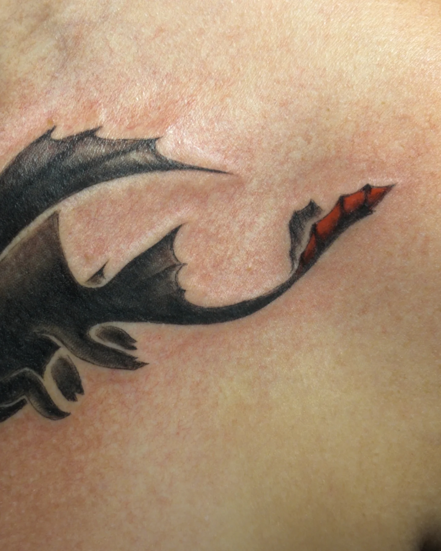 Dragon black and grey tattoo on the shoulder by Bek Artz