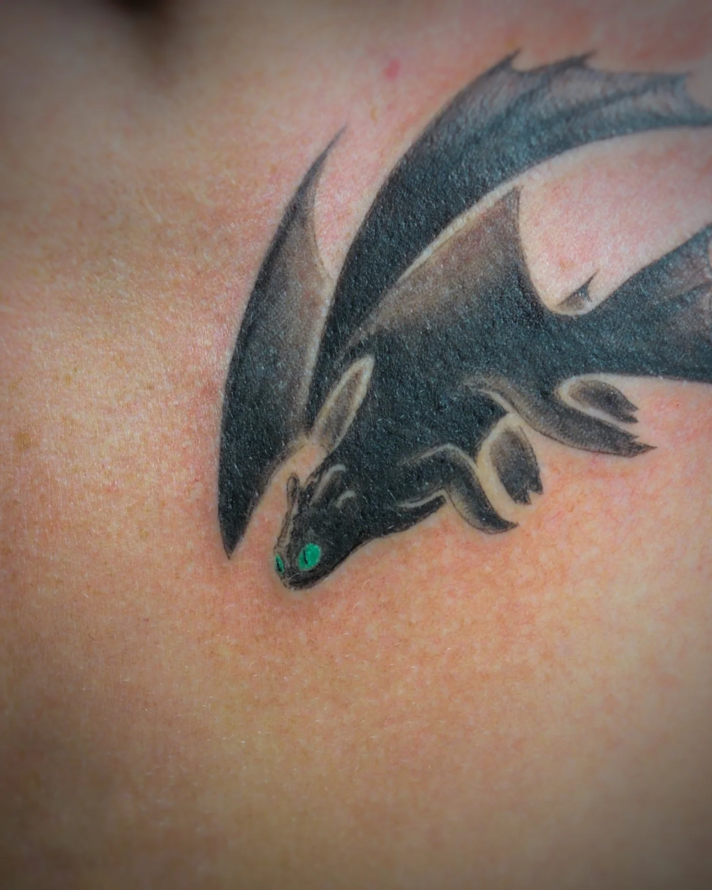 Dragon black and grey tattoo on the back by Bek Artz