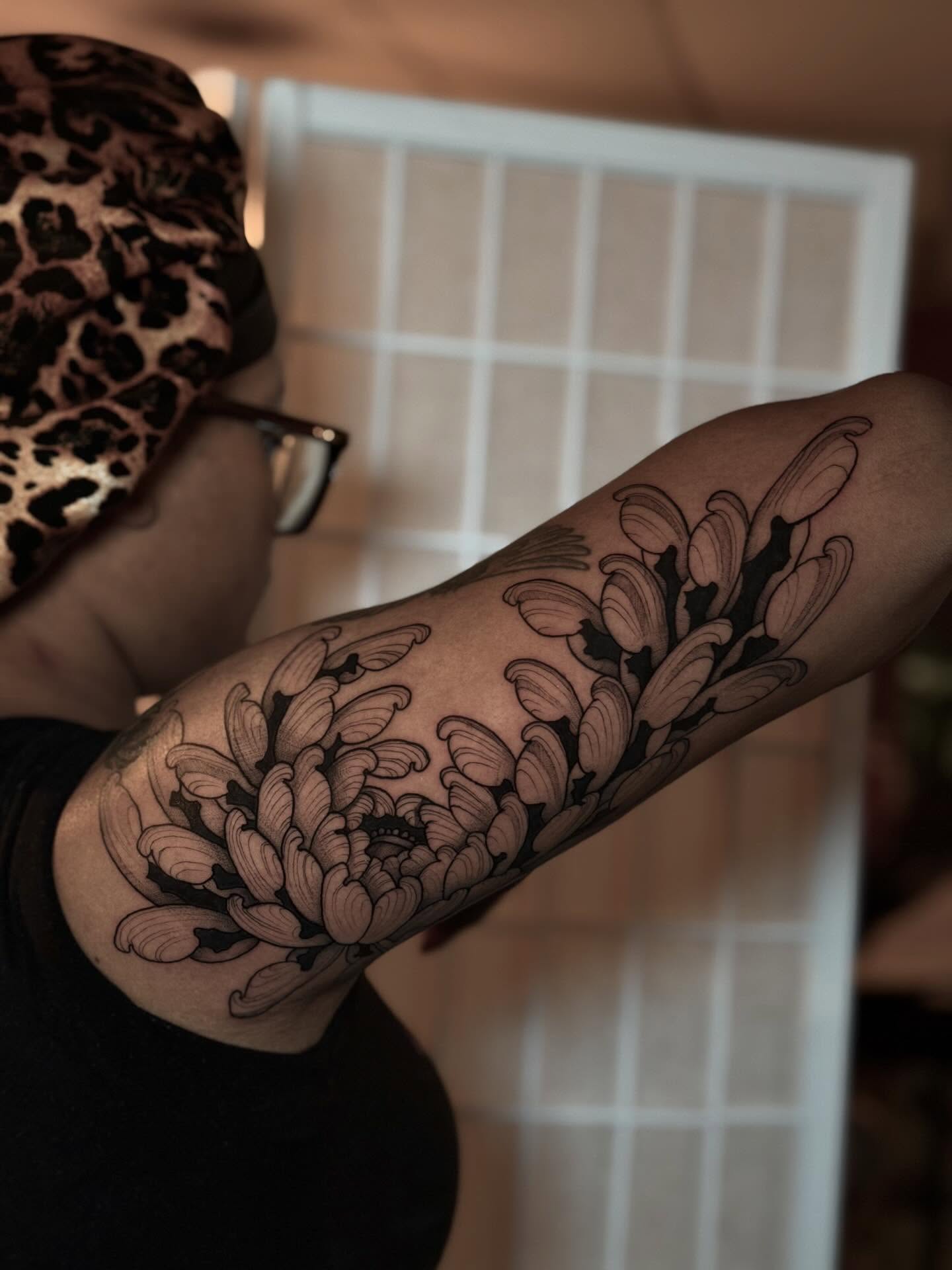 Chrysanthemum black and grey tattoo on the forearm by Kbtattz