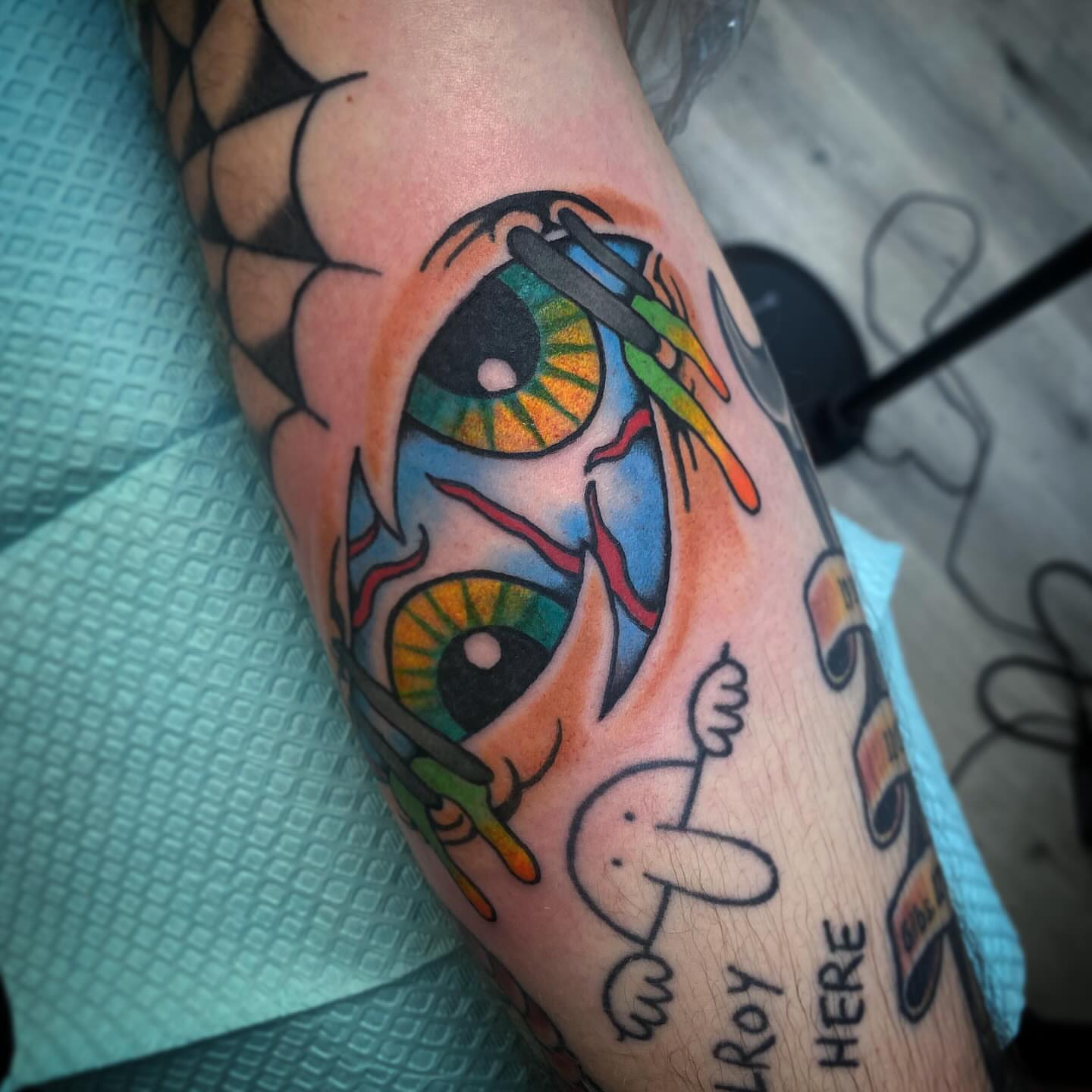 Eyes and rabbit American traditional tattoo on the forearm by Kyle Mitchell, Cincinnati