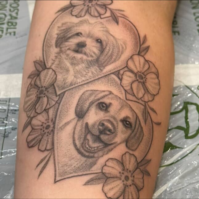 Dogs dotwork tattoo on the forearm by Sarah Seveney