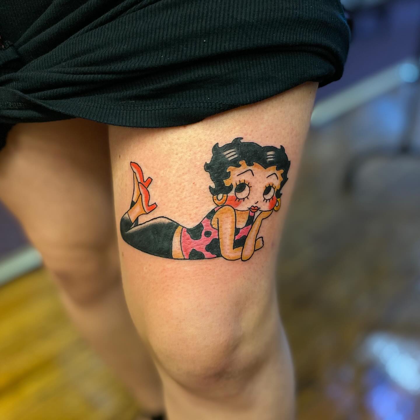 Betty Boop American traditional tattoo on the thigh by Tommy O'Connell