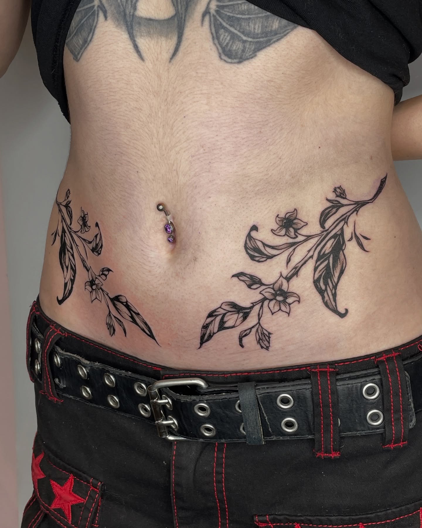 Floral branch black and grey tattoo on the torso by Mia 	\(★ω★)
