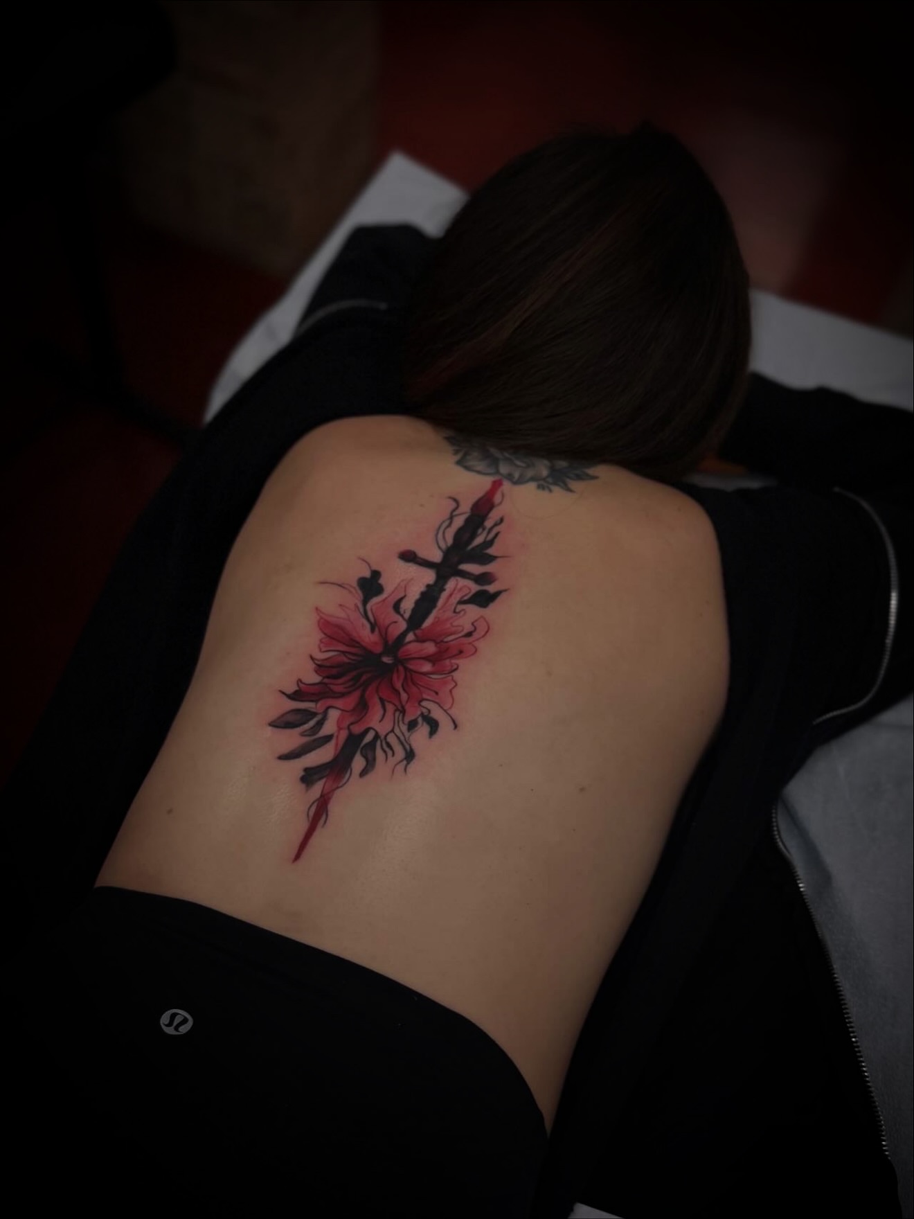 Cherry blossom with sword new school tattoo on the shoulder by Julian Olson
