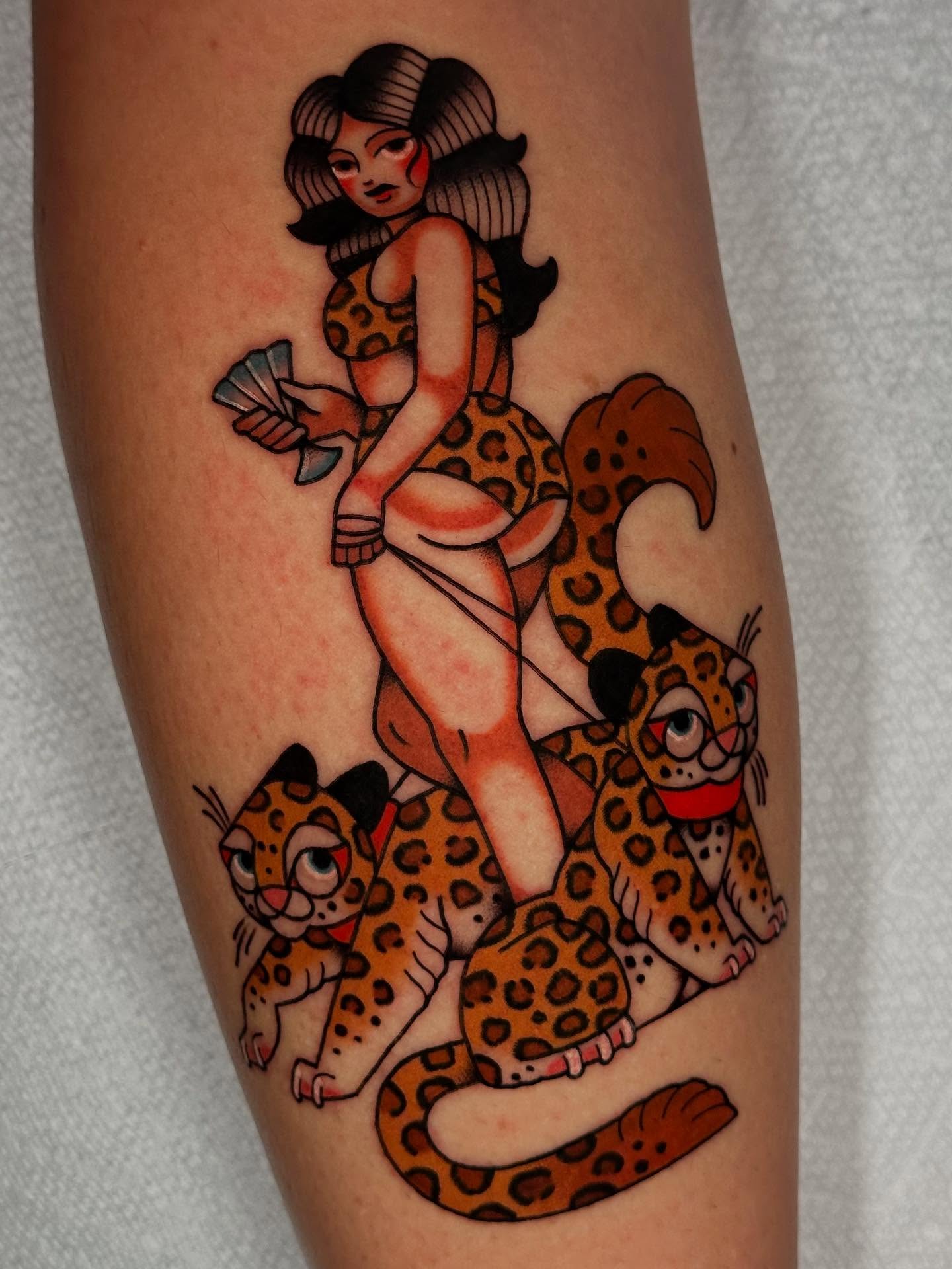 Woman riding leopards American traditional tattoo on the thigh by π»πππππ πΉπππ