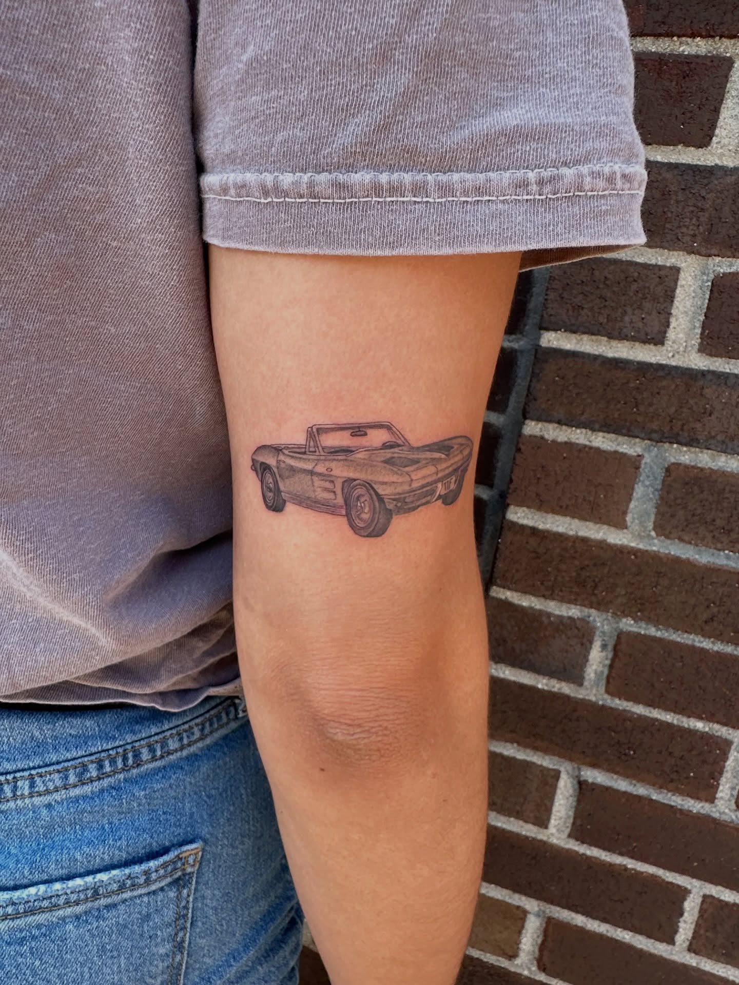 Convertible car black and grey tattoo on the forearm by Hail Chaney, Somerville, Massachusetts