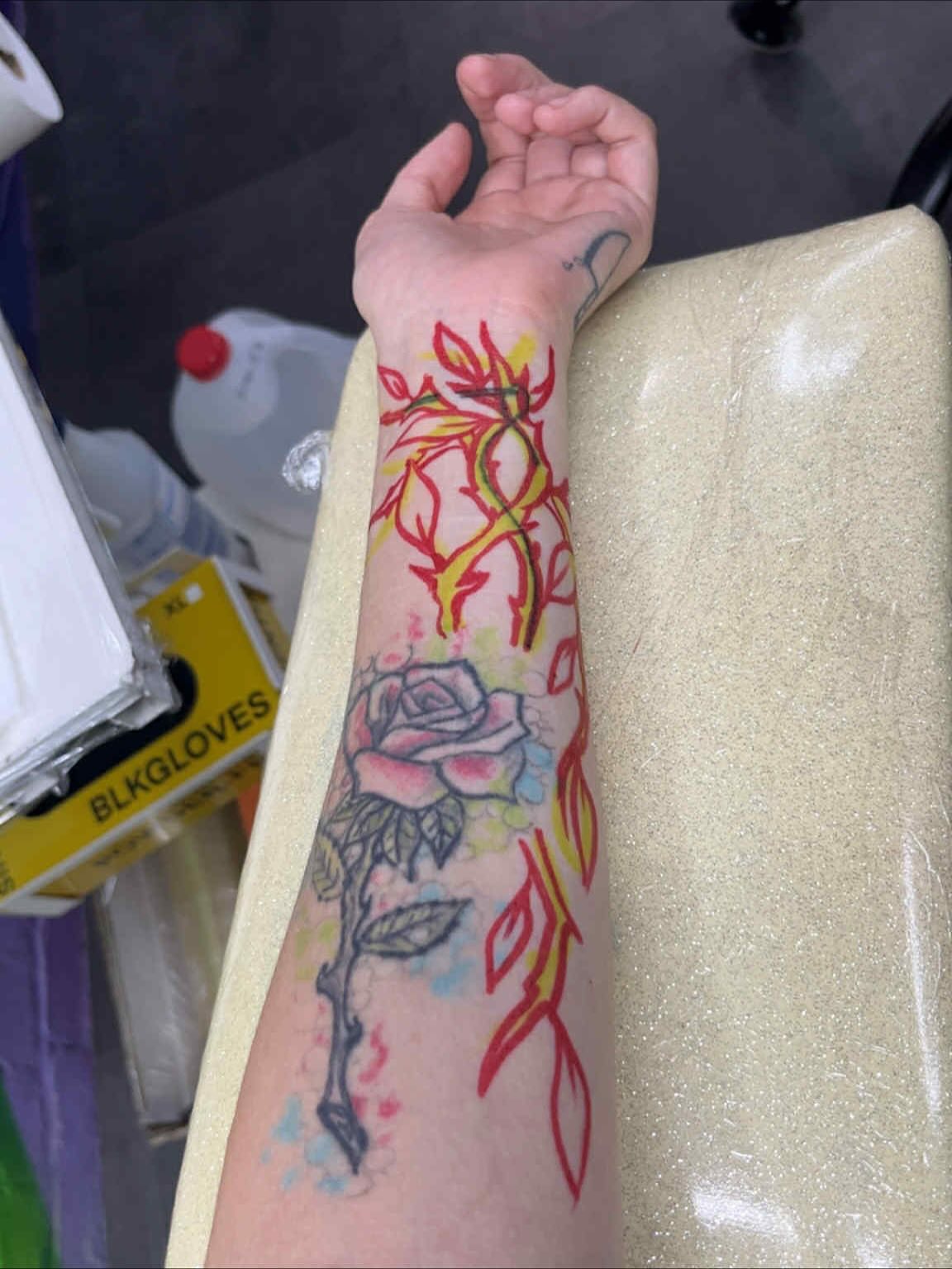 Rose and thorns watercolor tattoo on the forearm by Sav