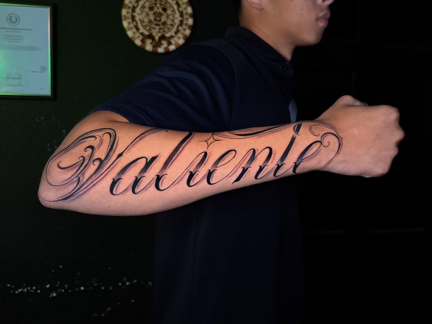 Valentine lettering script tattoo on the forearm by 📍 Austin