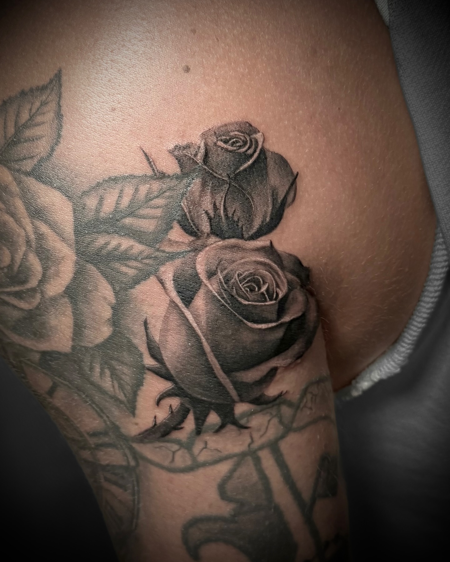 Roses black and grey tattoo on the forearm by Tattoos by Katherina, Willoughby, Ohio
