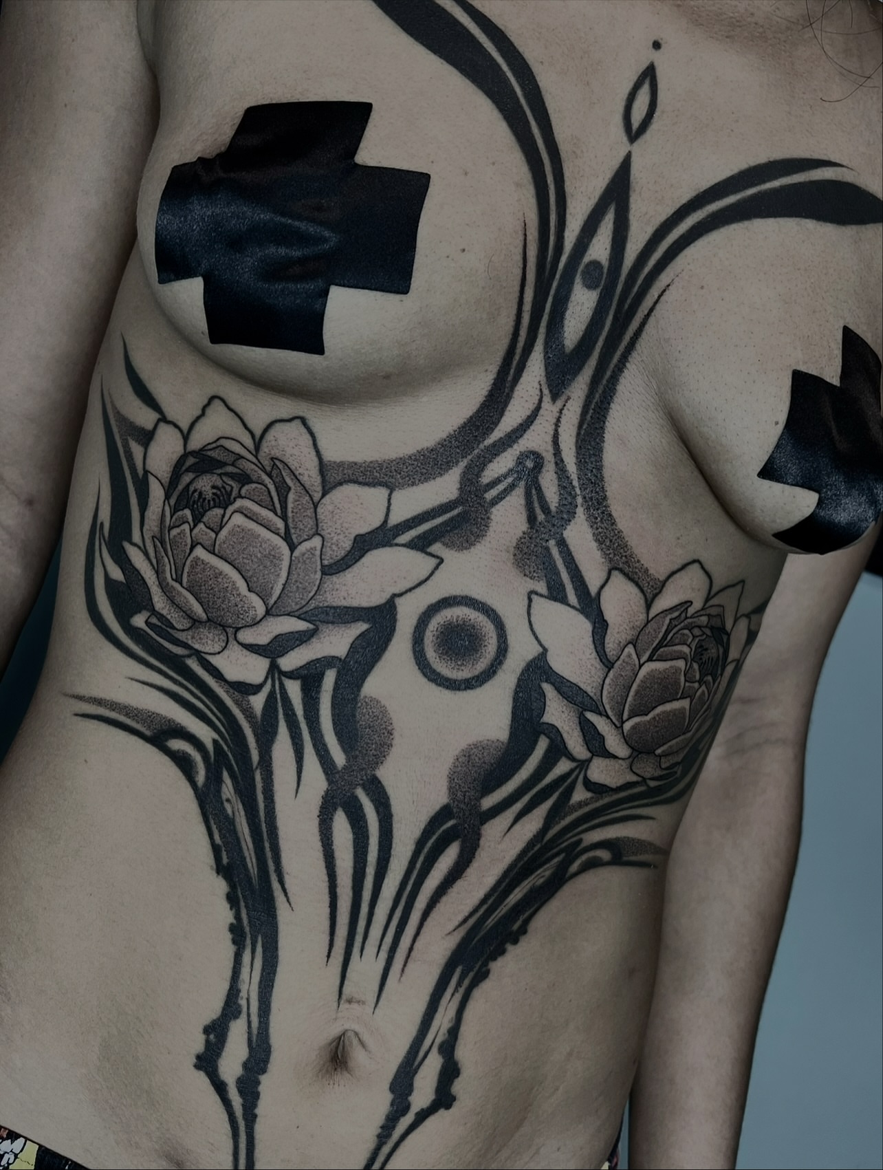 Lotus flowers dotwork tattoo on the chest by ༒ boniandi༒