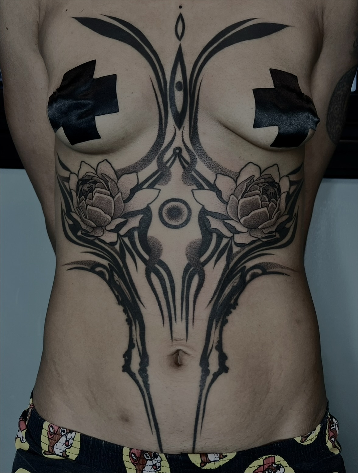 Lotus flowers geometric tattoo on the torso by ༒ boniandi༒