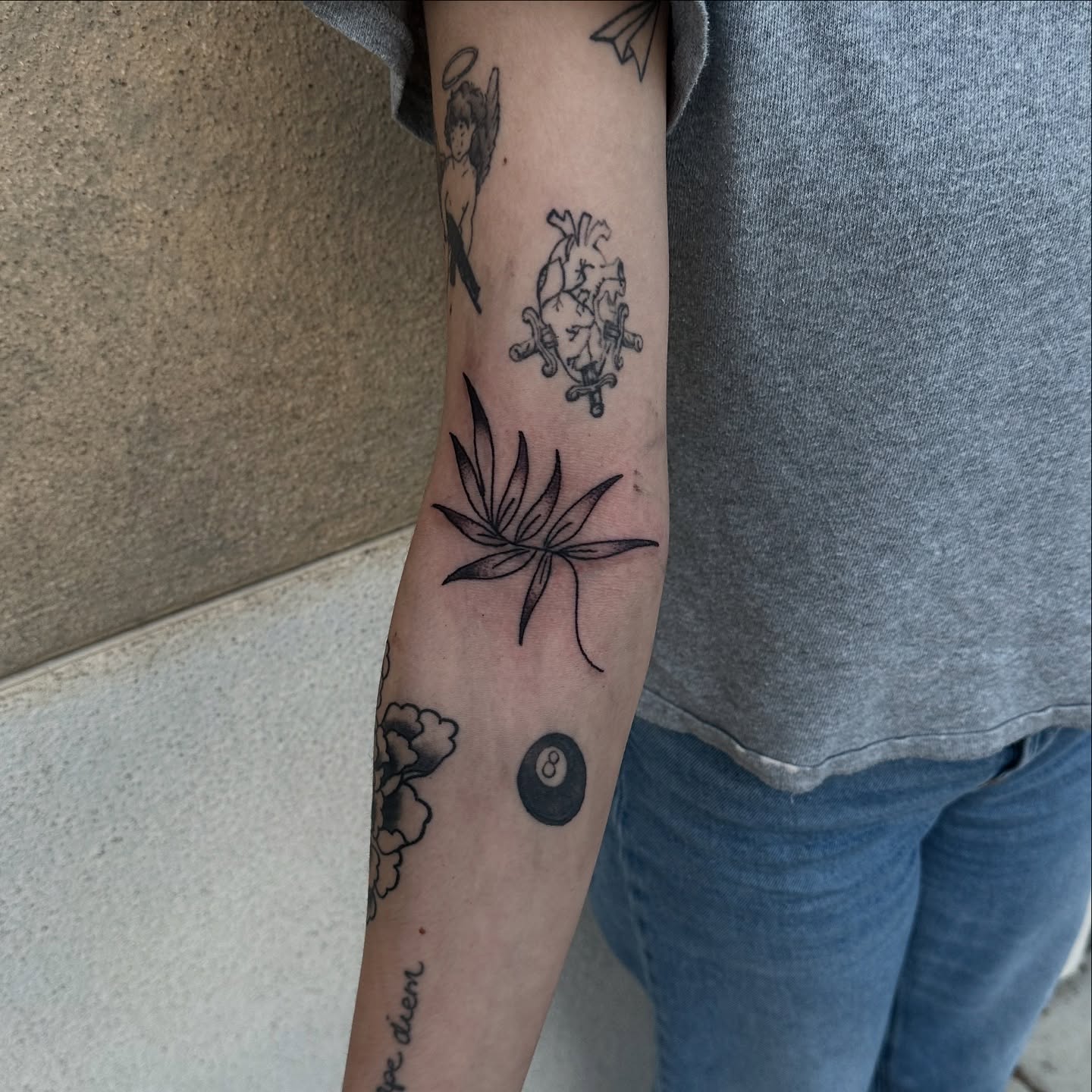 Marijuana leaf black and grey tattoo on the forearm by Gabriel F Kingston Beitia