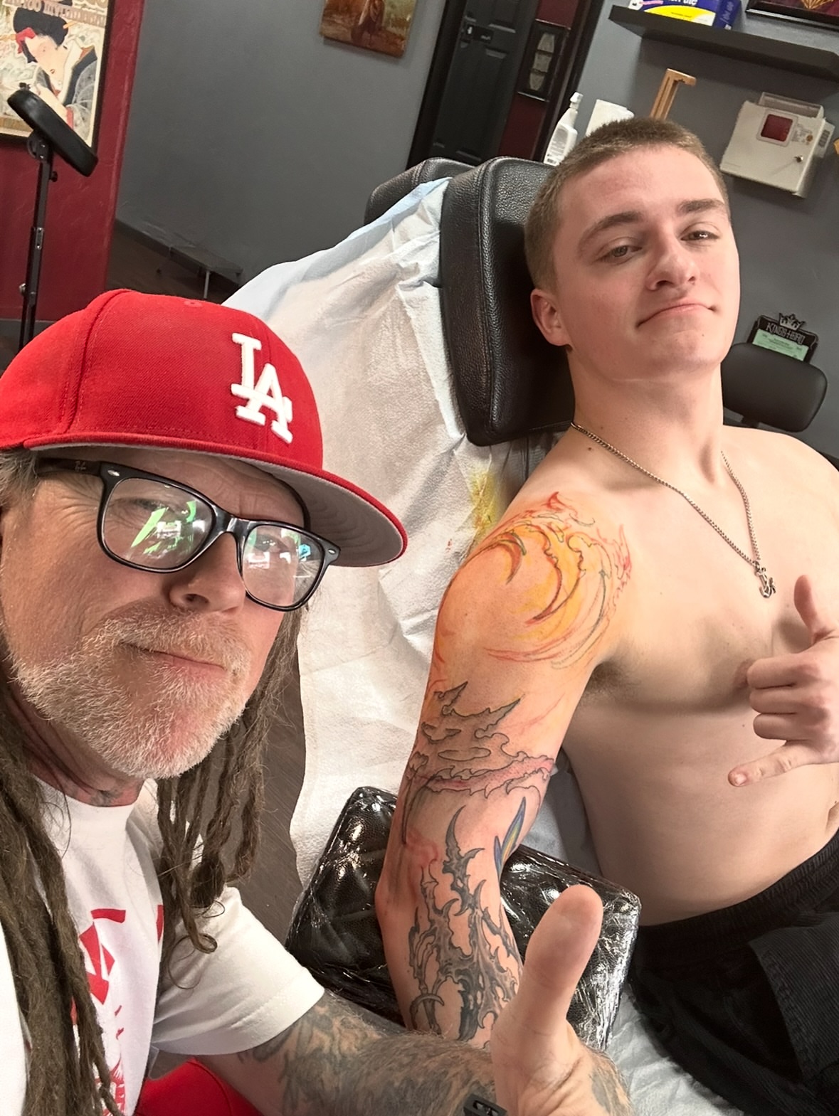 Flame and clouds neo-traditional tattoo on the chest by Culleton Paramore