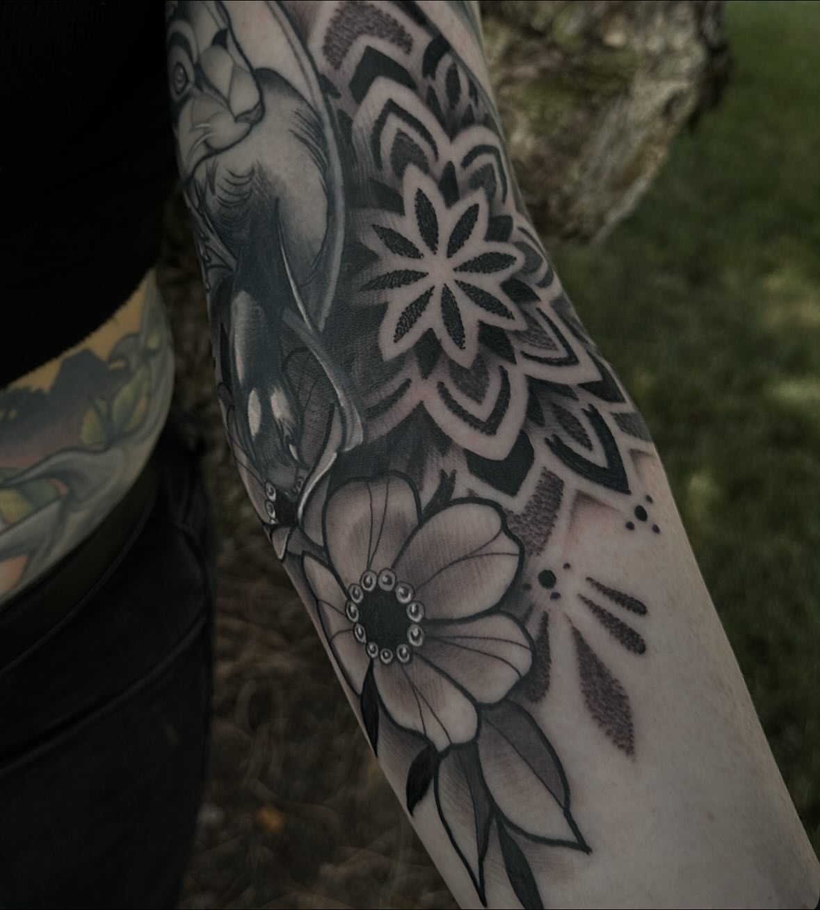 Floral design geometric tattoo on the forearm by Javier Rivera