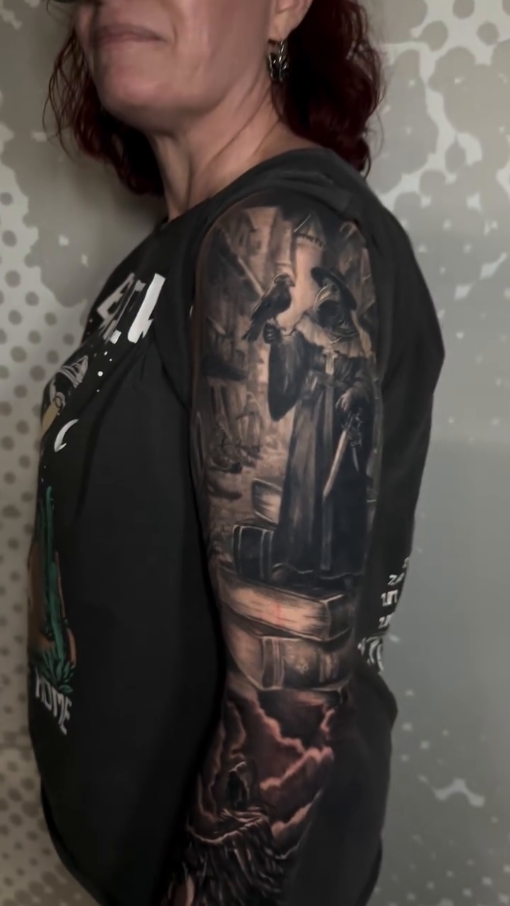 Plague doctor and stormy landscape dark realism tattoo by Charlotte Tattoo Artist