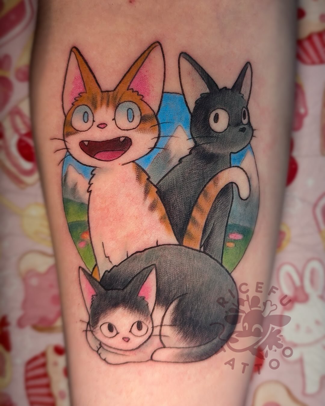 Three cats anime tattoo on the forearm by Ricefu Art & Tattoo