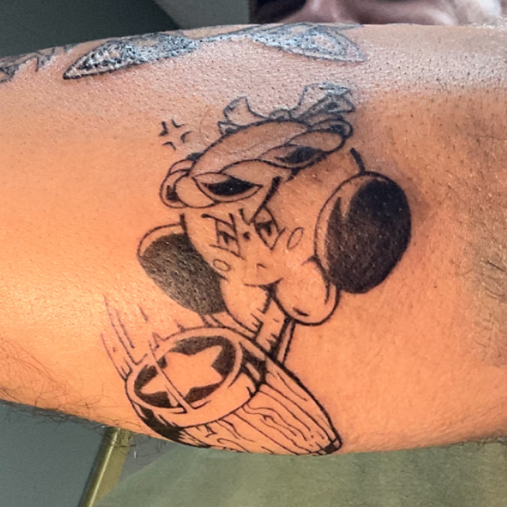 Cowboy character American traditional tattoo on the forearm by Isaac Mccavitt