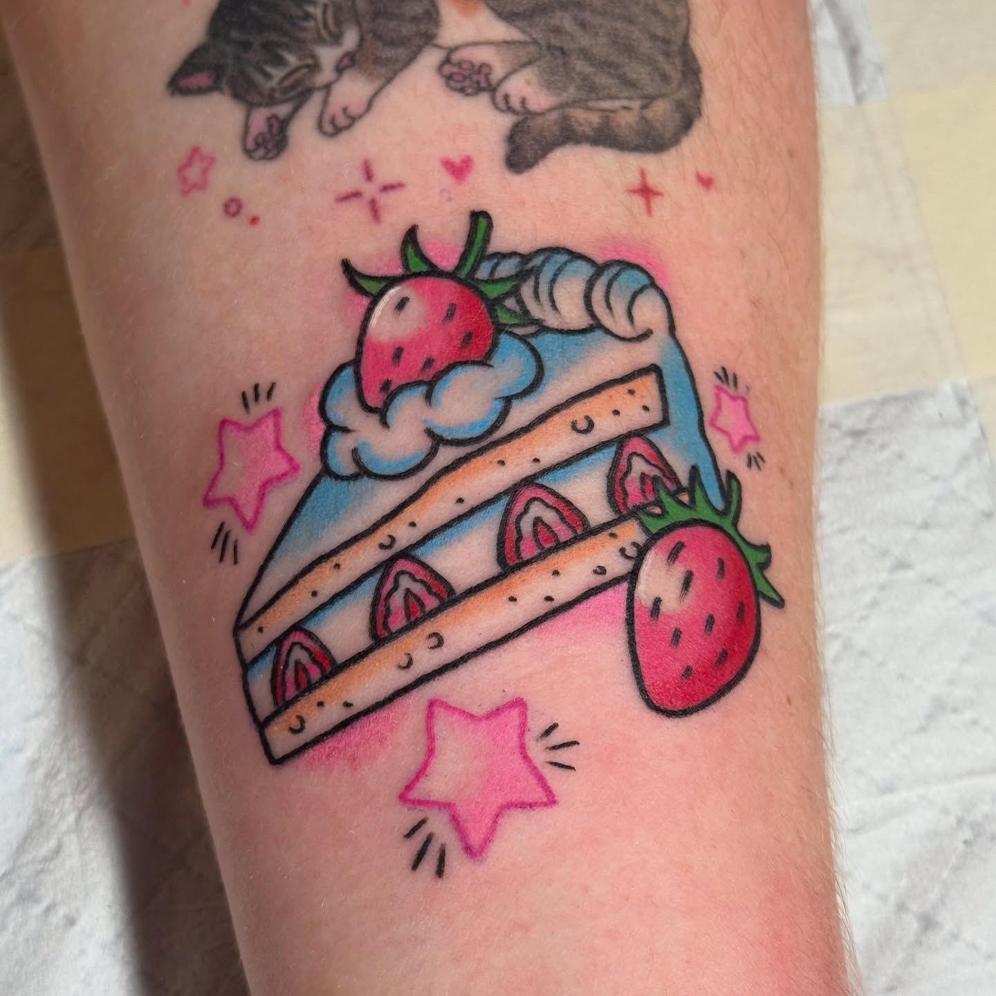 Strawberry shortcake new school tattoo on the forearm by vic