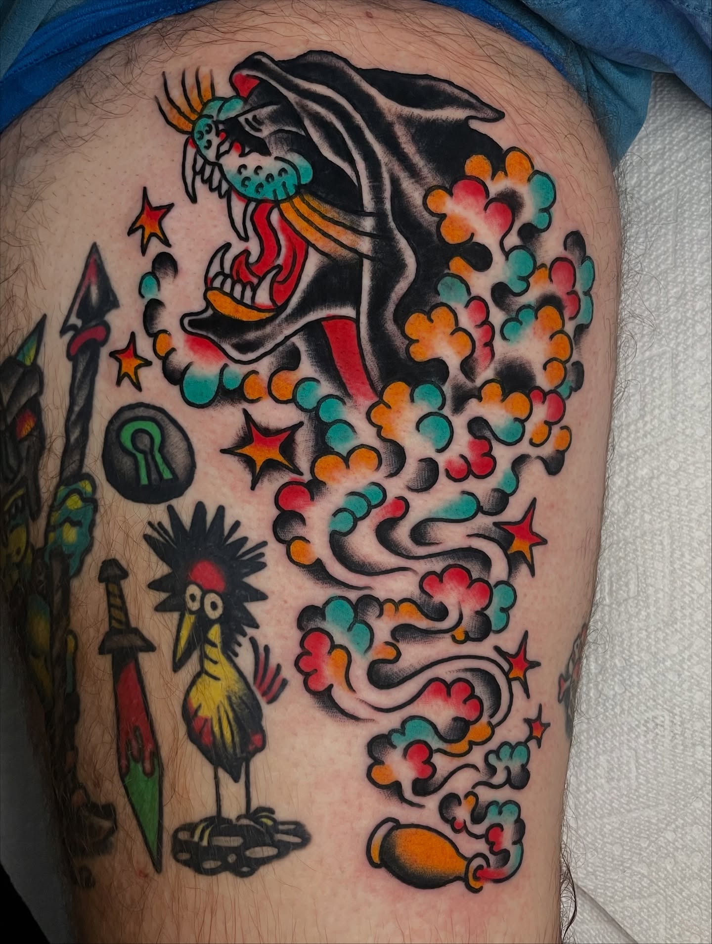 Demon and bird American traditional tattoo on the thigh by David Armacost, Cincinnati, Ohio