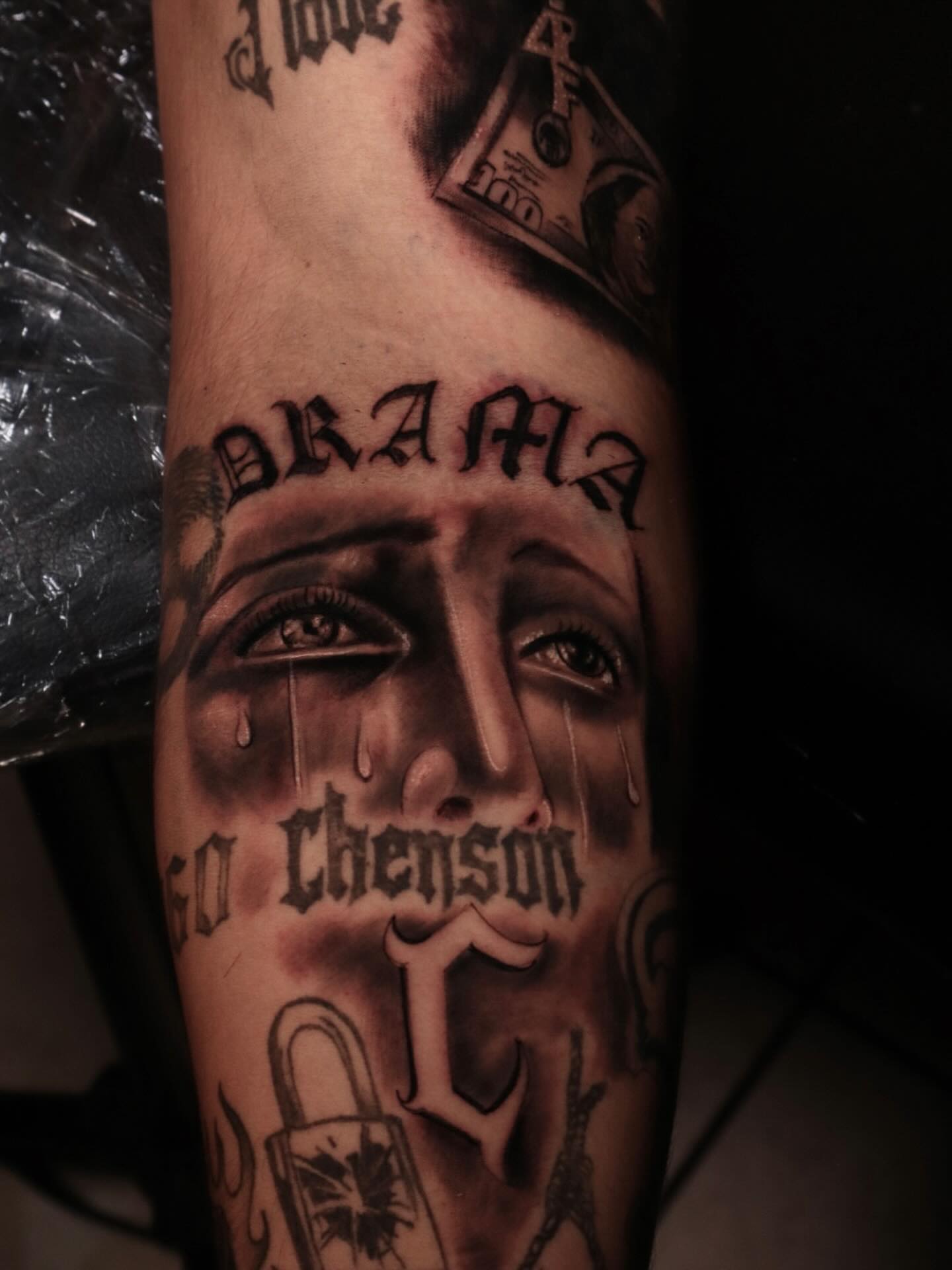 Tearful face realism tattoo on the forearm by Mr Letters🗡️