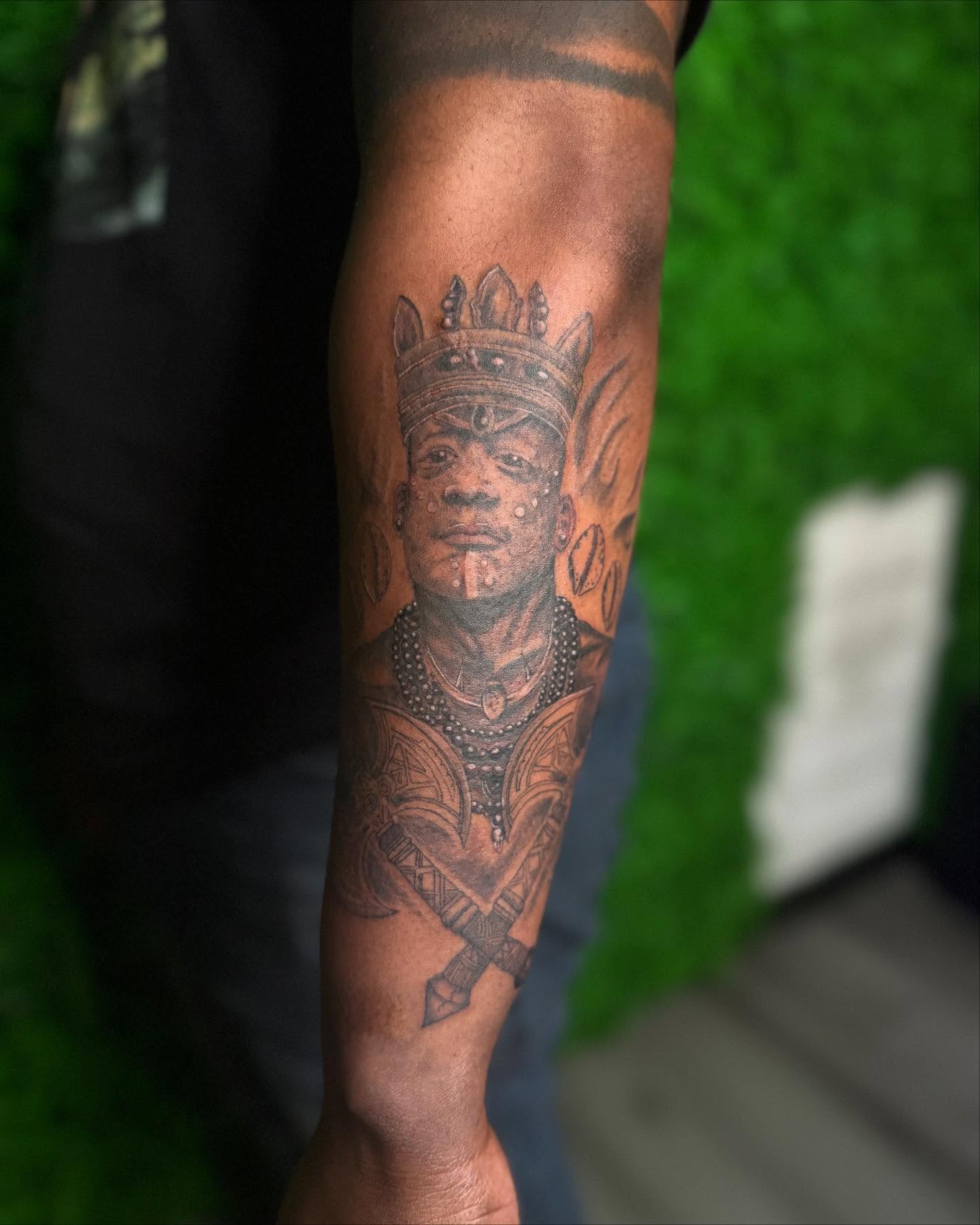 Portrait of a person black and grey tattoo on the forearm by Los Angeles Tattoo Artist
