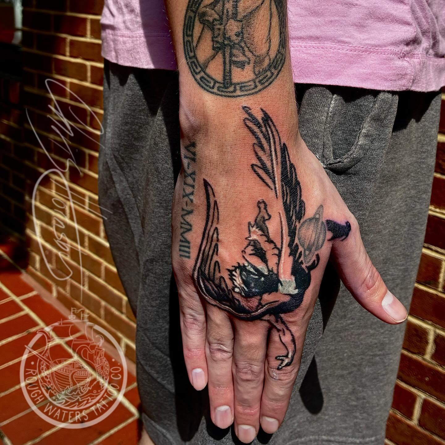 Winged creature neo-traditional tattoo on the hand by Chris Hornsby