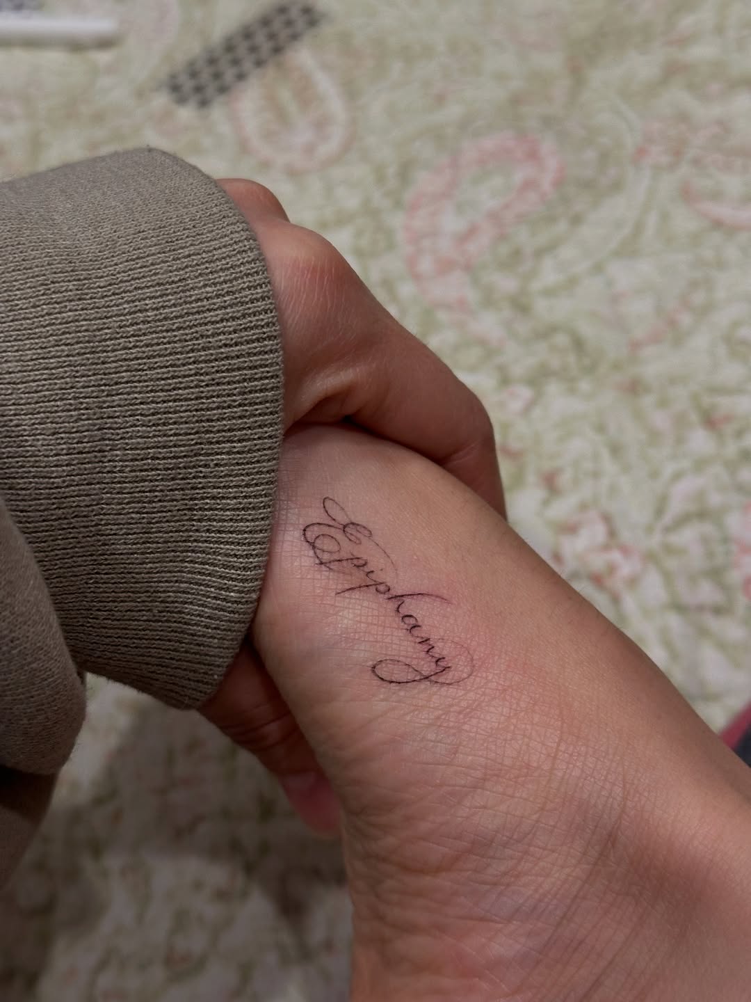 Epiphany script lettering tattoo on the forearm by @taravychi