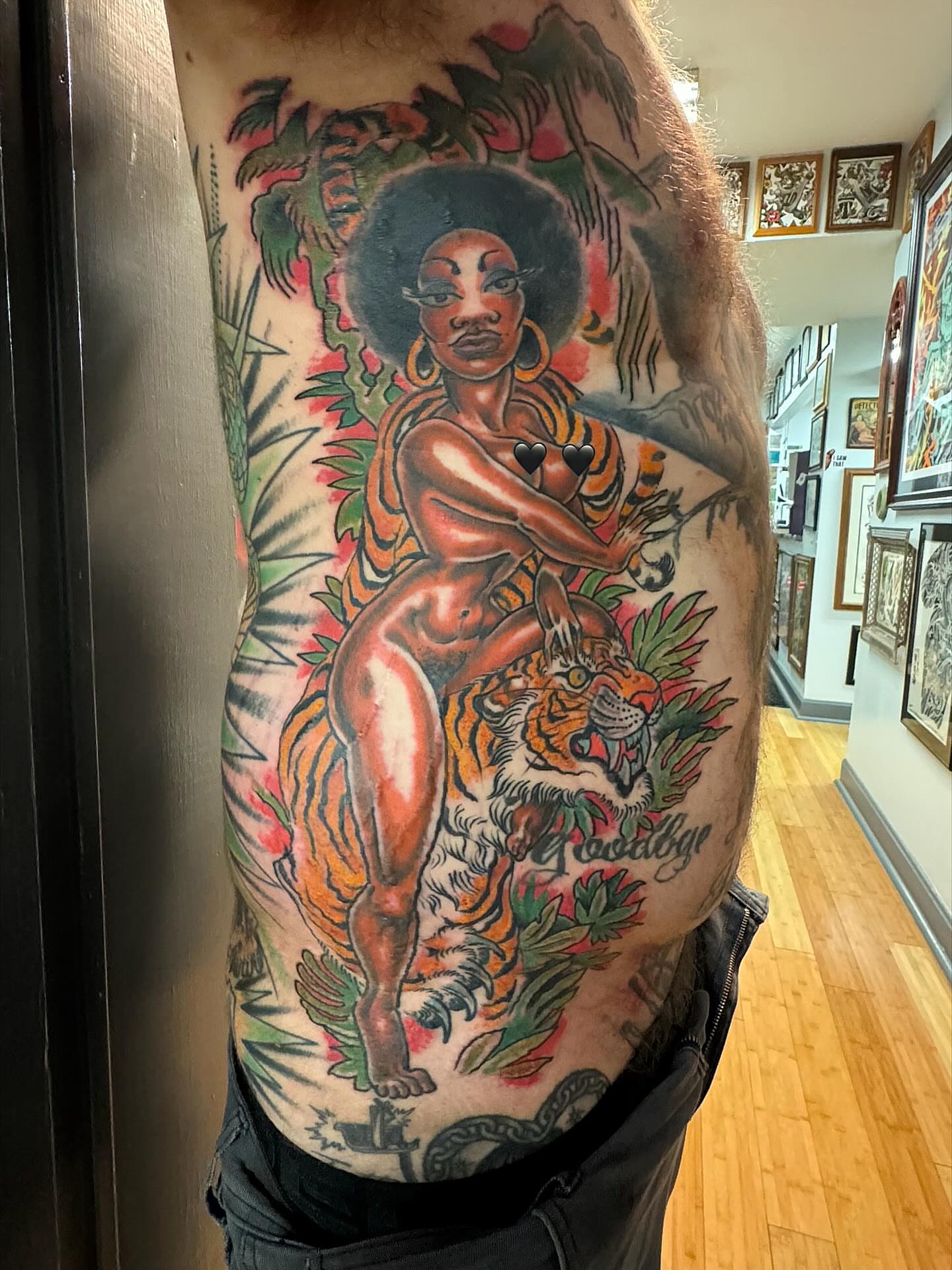 Woman with tiger American traditional tattoo on the torso by Tim Lehi, Oakland, California