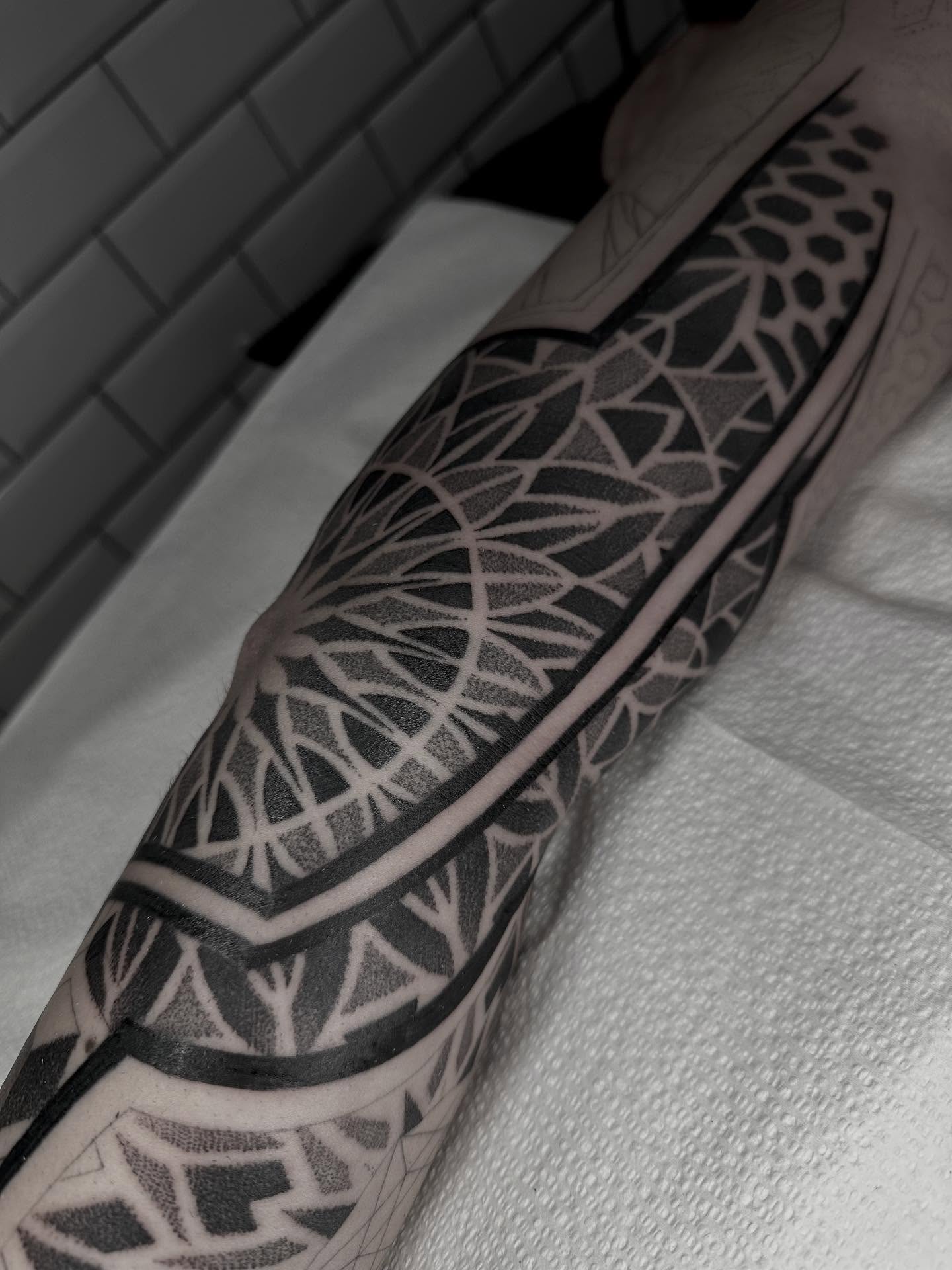 Geometric pattern geometric tattoo on the forearm by Kevin Johnson