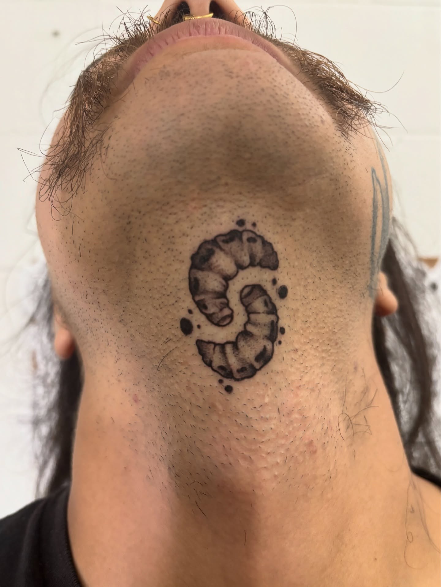 Worm dotwork tattoo on the neck by Ares Rhodes