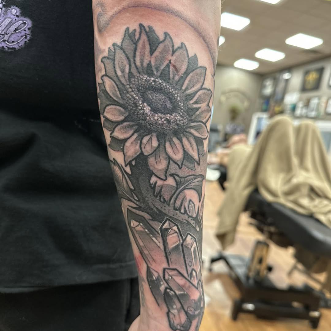 Sunflower and crystals realism tattoo on the forearm by Tattoos by Aeron Herald Maurbjorn, Sioux