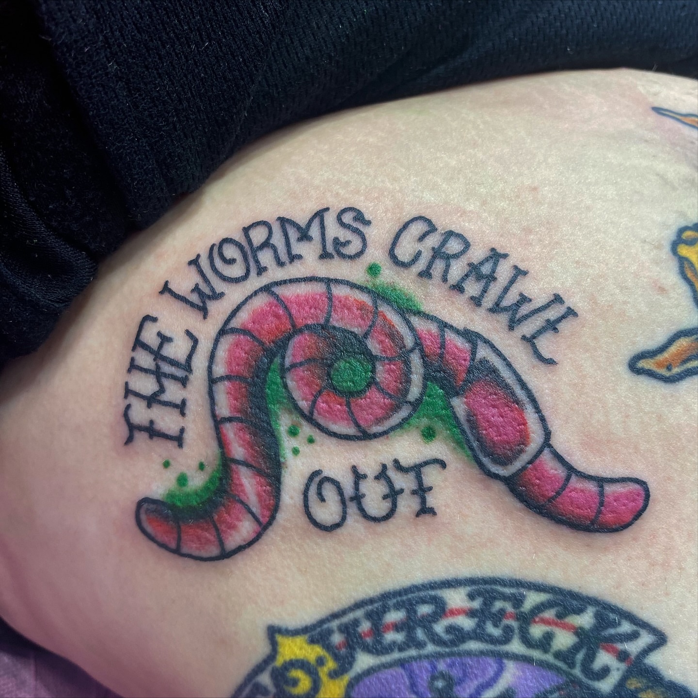 Worms crawling out dotwork tattoo on the torso by @katie_tatts