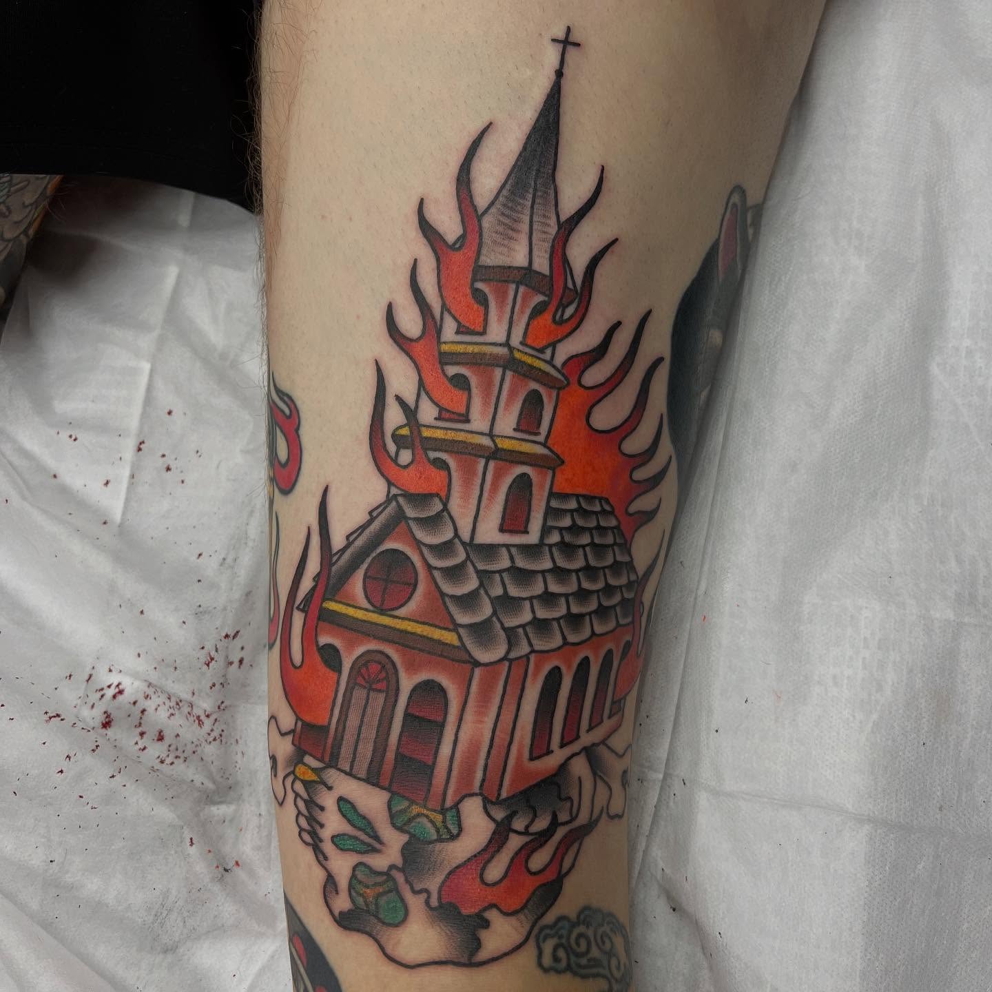 Burning church American traditional tattoo on the forearm by doodle